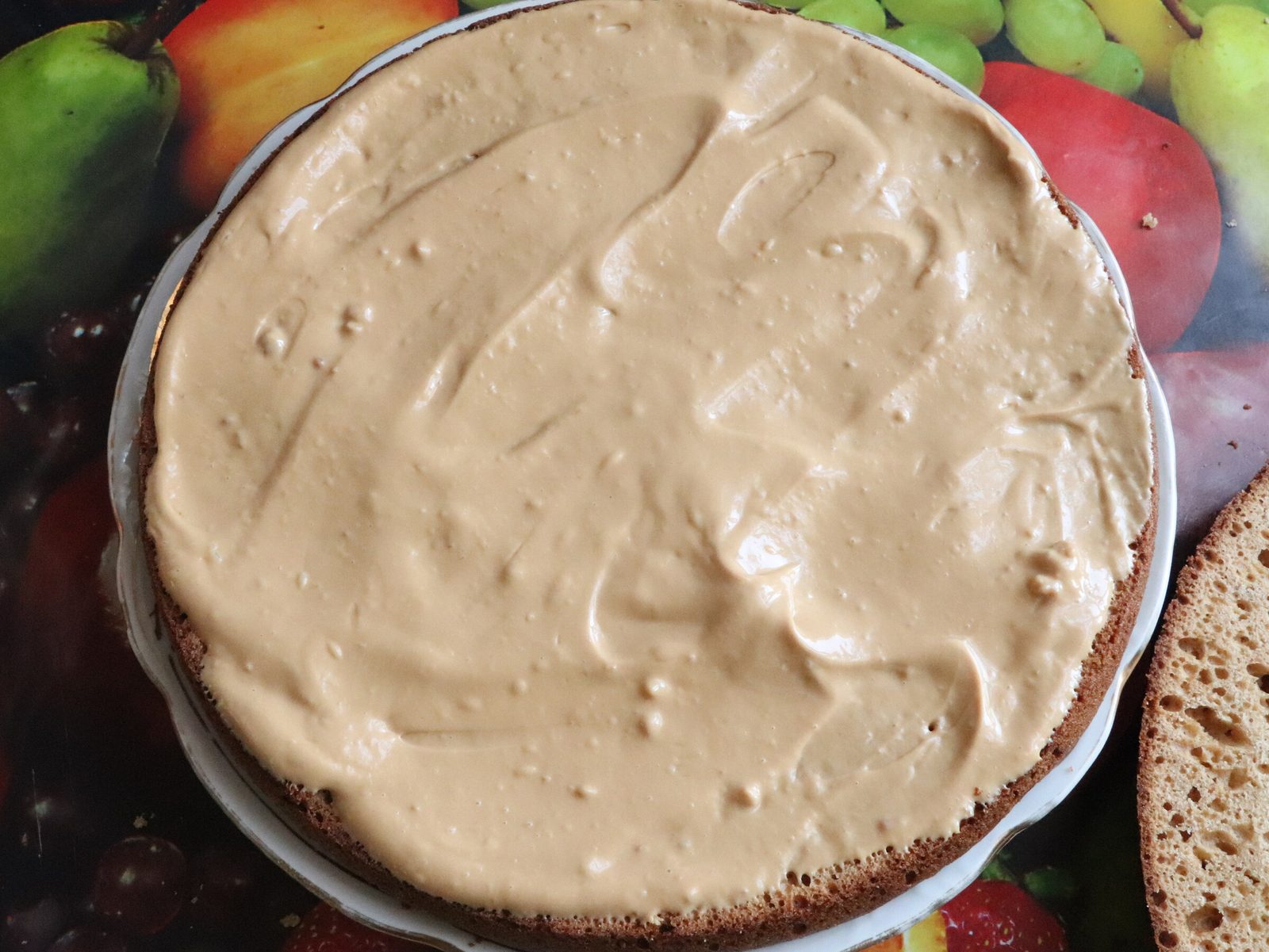 Step 4. For the cream, beat butter softened at room temperature with boiled condensed. A quick cake from the cupboard