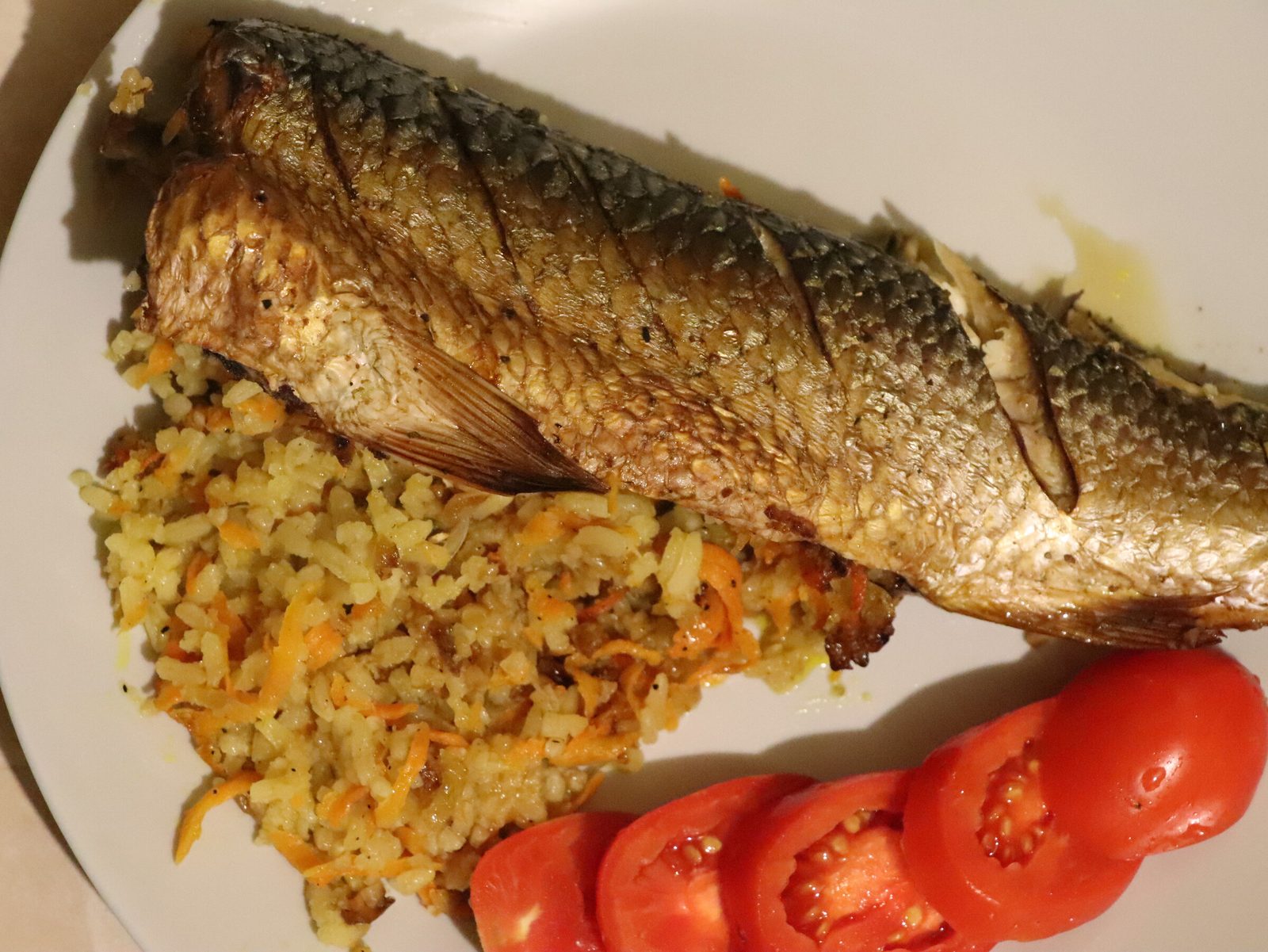 Baked stuffed grey mullet