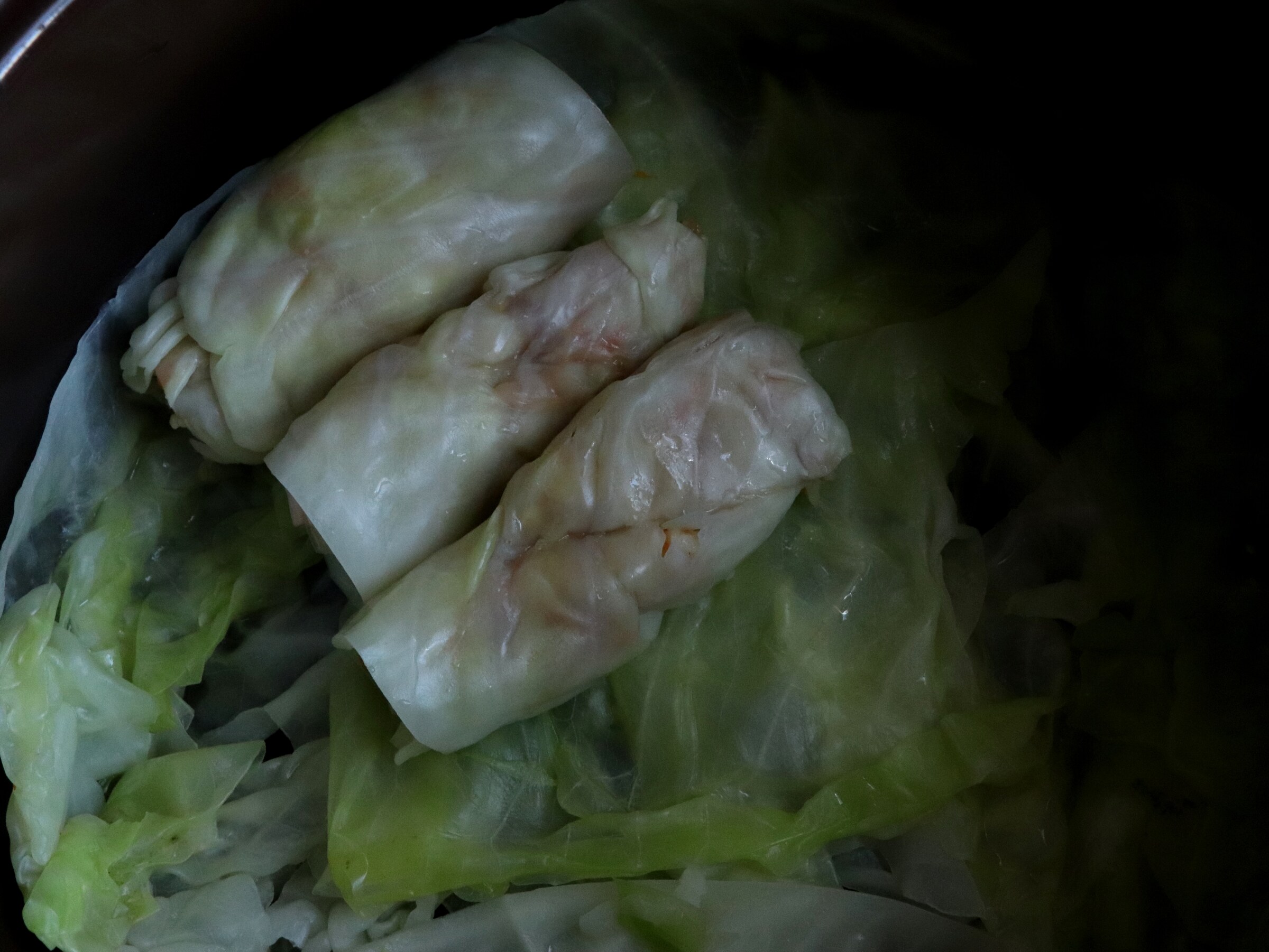 Step 5. Line the bottom of the pan with several cabbage leaves. Cabbage rolls in a sweet-and-sour sauce