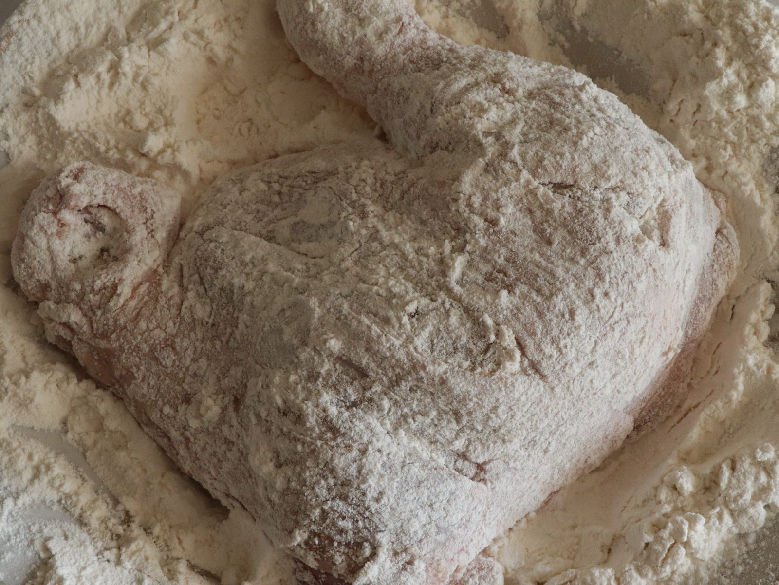 Step 4. Take 1 quarter and dip it in flour on both sides, then dip it in the egg. Chicken quarters in a double crumb