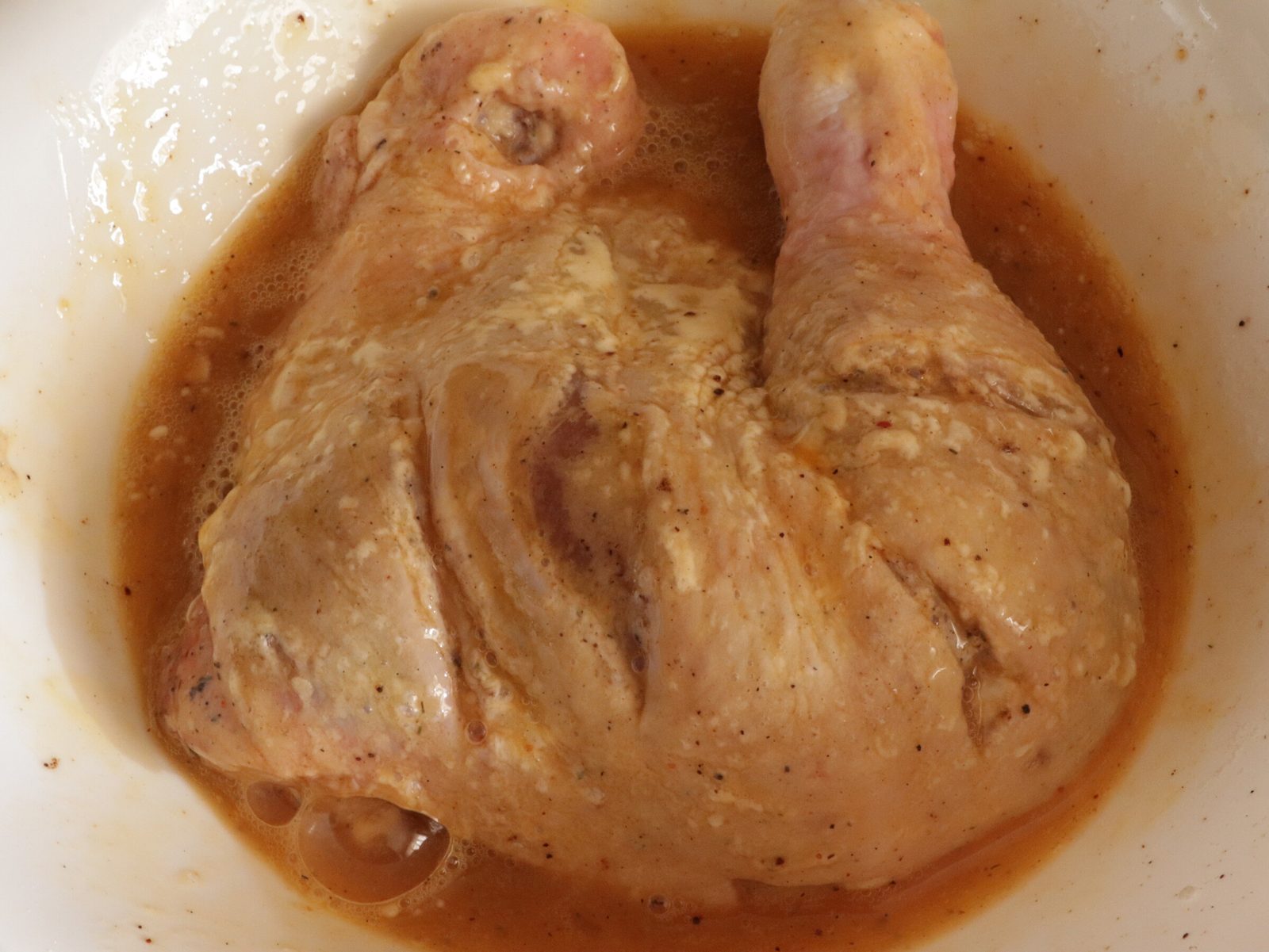 Step 5. Place the fried chicken on a baking tray, sprinkle with chopped garlic and. Chicken quarters in a double crumb