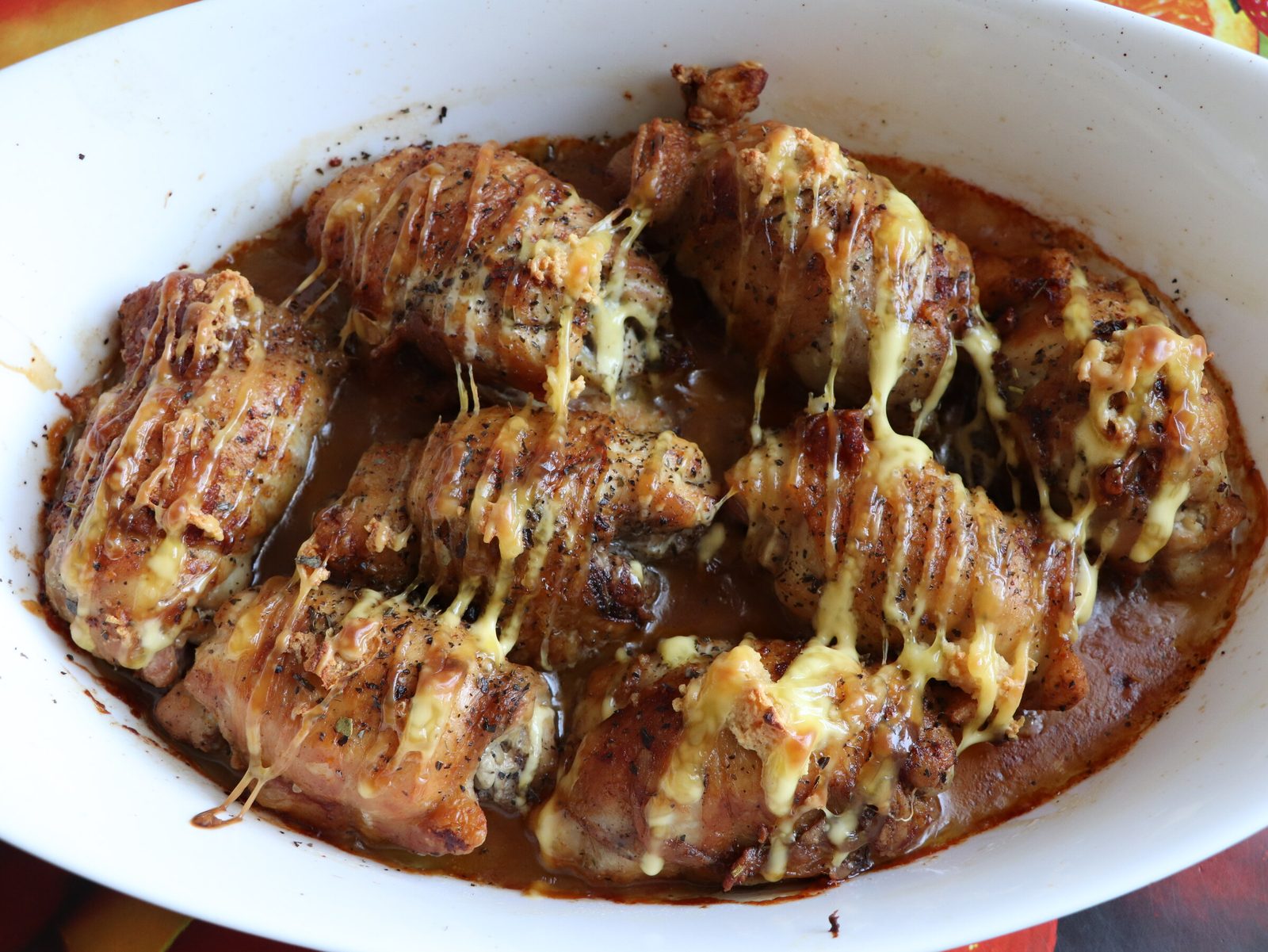 Step 5. Place the fried rolls in a heat-resistant form or on a baking tray. Chicken rolls