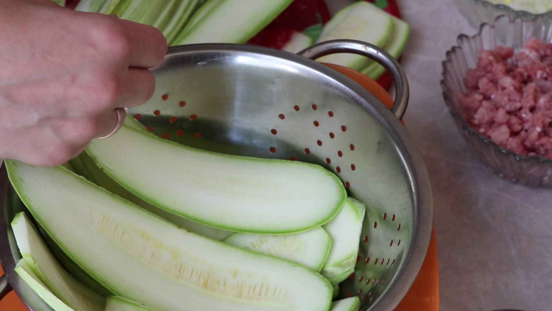 Step 3. Lightly salt the strips and set aside. Courgette ‘cabbage rolls’ in the pan