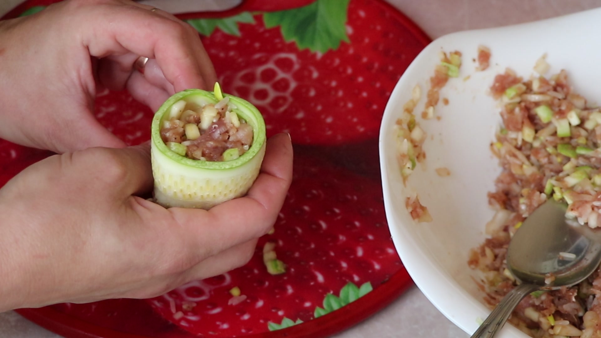 Step 6. Take a strip of courgette, use a spoon to spread the filling and wrap it in a. Courgette ‘cabbage rolls’ in the pan