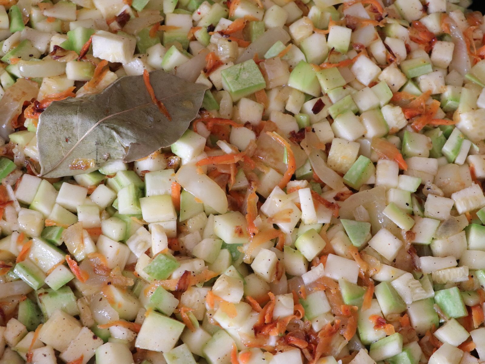 Step 6. Add the courgette and bay leaf to the vegetables, mix everything and cover with. Courgette caviar