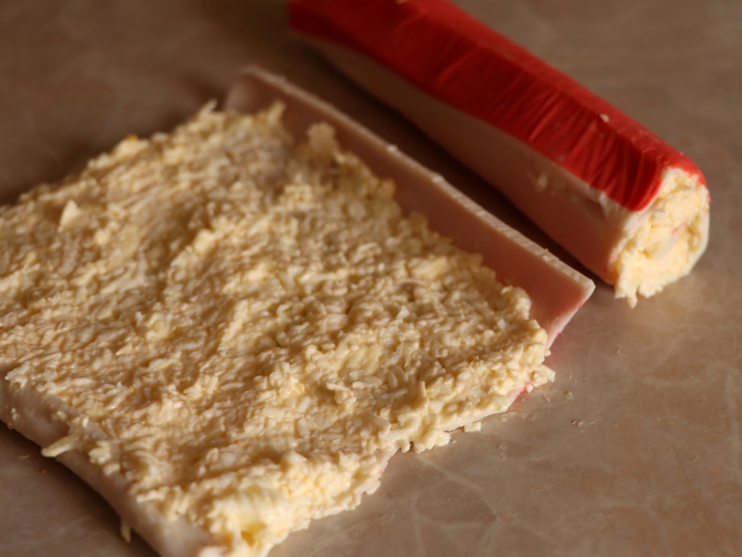 Step 3. Spread a thin layer of filling and roll, pressing lightly. Crab-stick starter