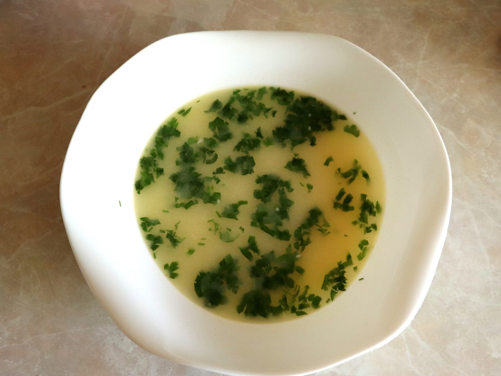 Step 8. Turn off the soup and add chopped parsley to it. Creamy melted-cheese soup