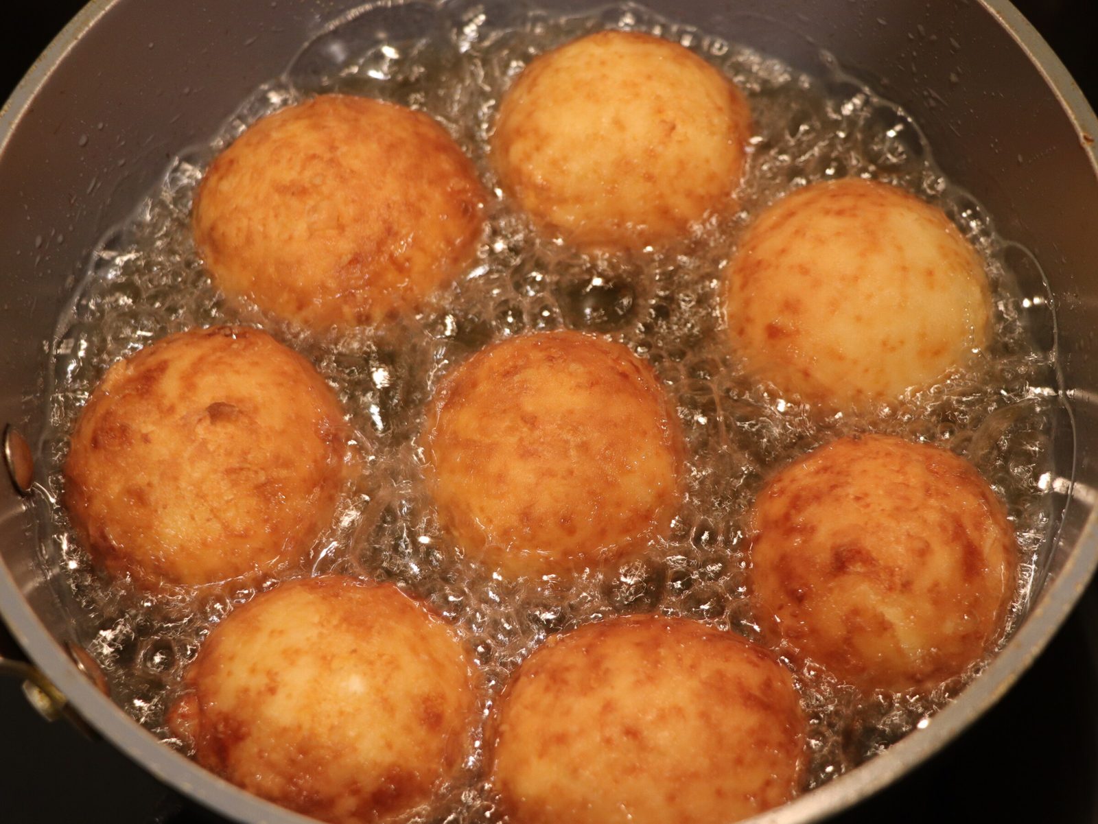 Step 3. Roll out the prepared dough into a sausage, cut off small pieces and form into. Deep-fried curd-cheese balls
