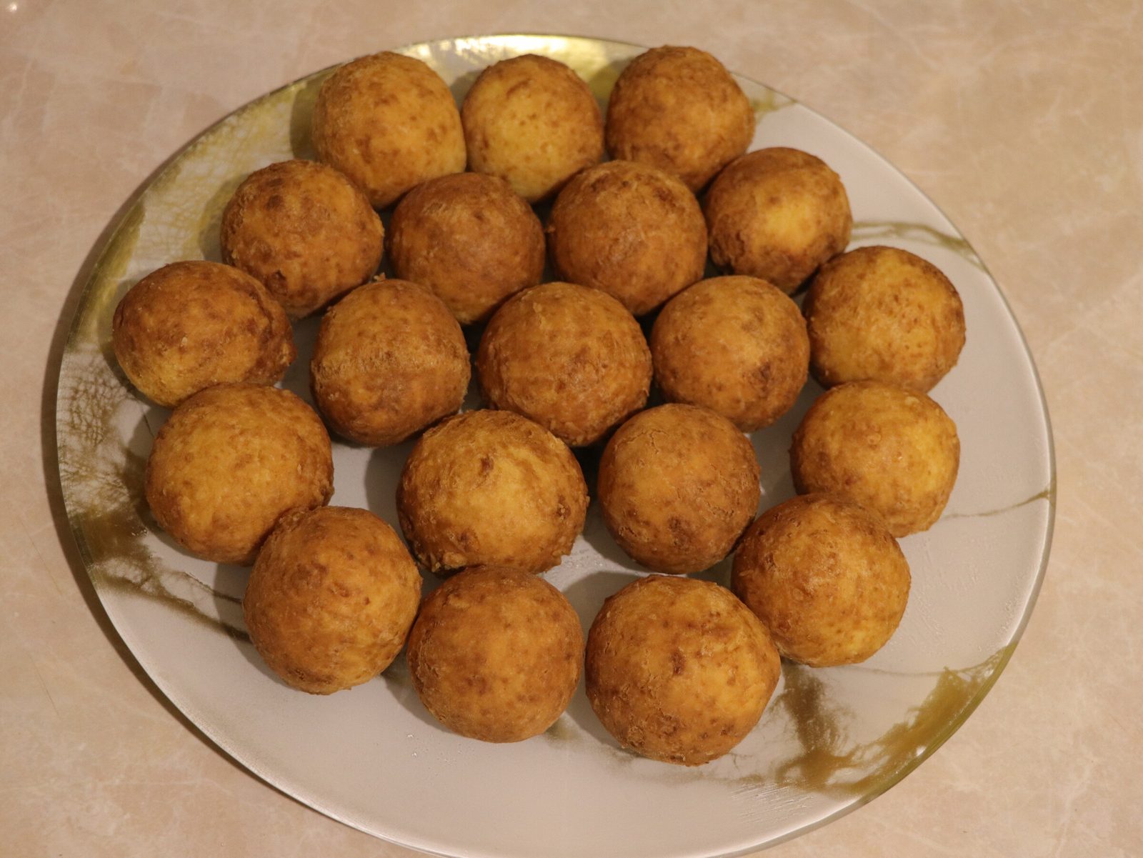Step 4. Pour refined sunflower oil into a saucepan or other container with a thick. Deep-fried curd-cheese balls