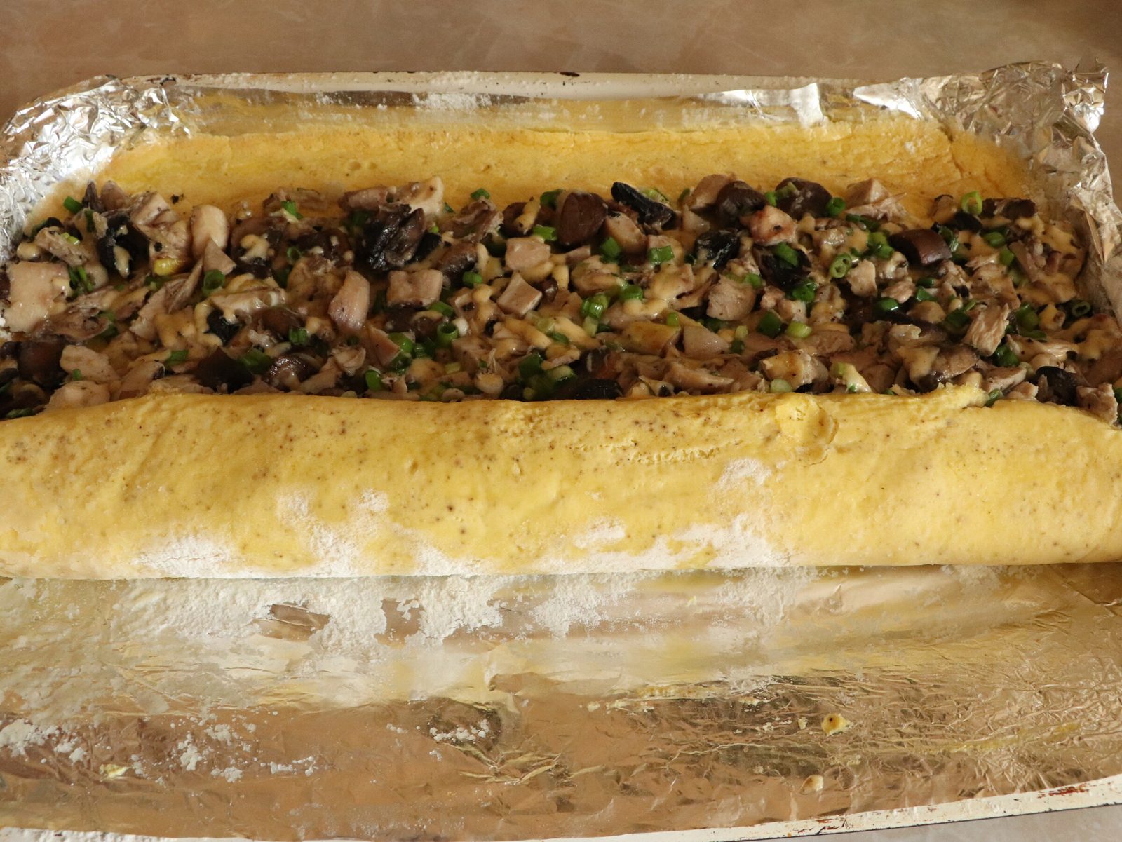Step 6. The flour stops it sticking; the foil helps you roll it neatly. Egg roll in 15 minutes