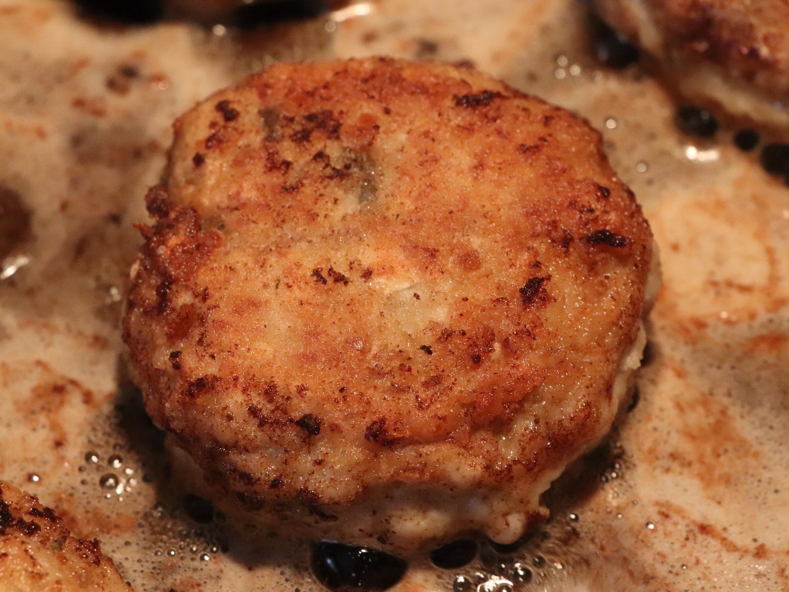 Step 4. Beat in the egg, add spices and stir thoroughly until the mixture becomes smooth. Fish and chicken rissoles