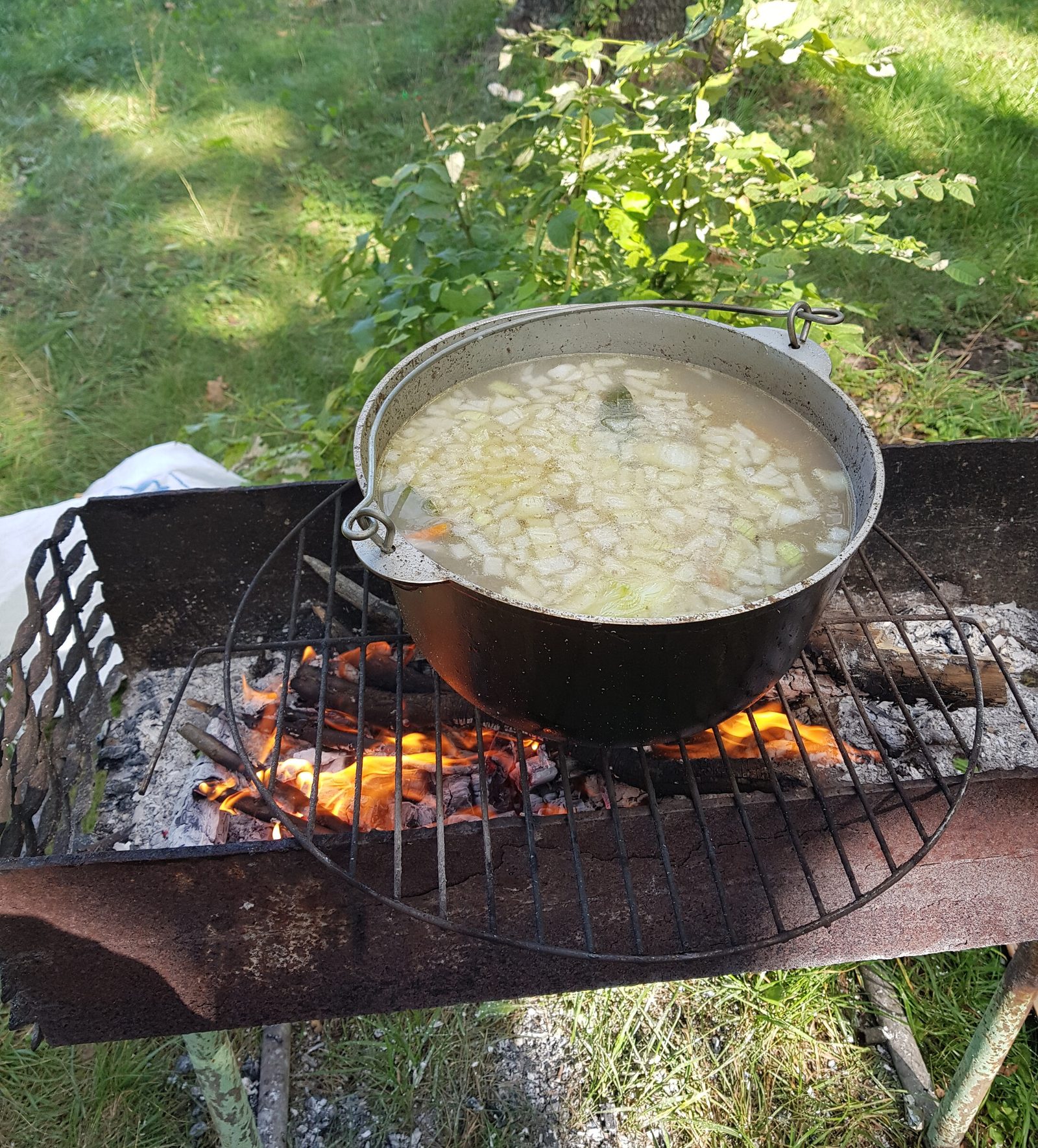 Step 1. Let's start preparing all the ingredients. Fish broth (ukha) in a kazan