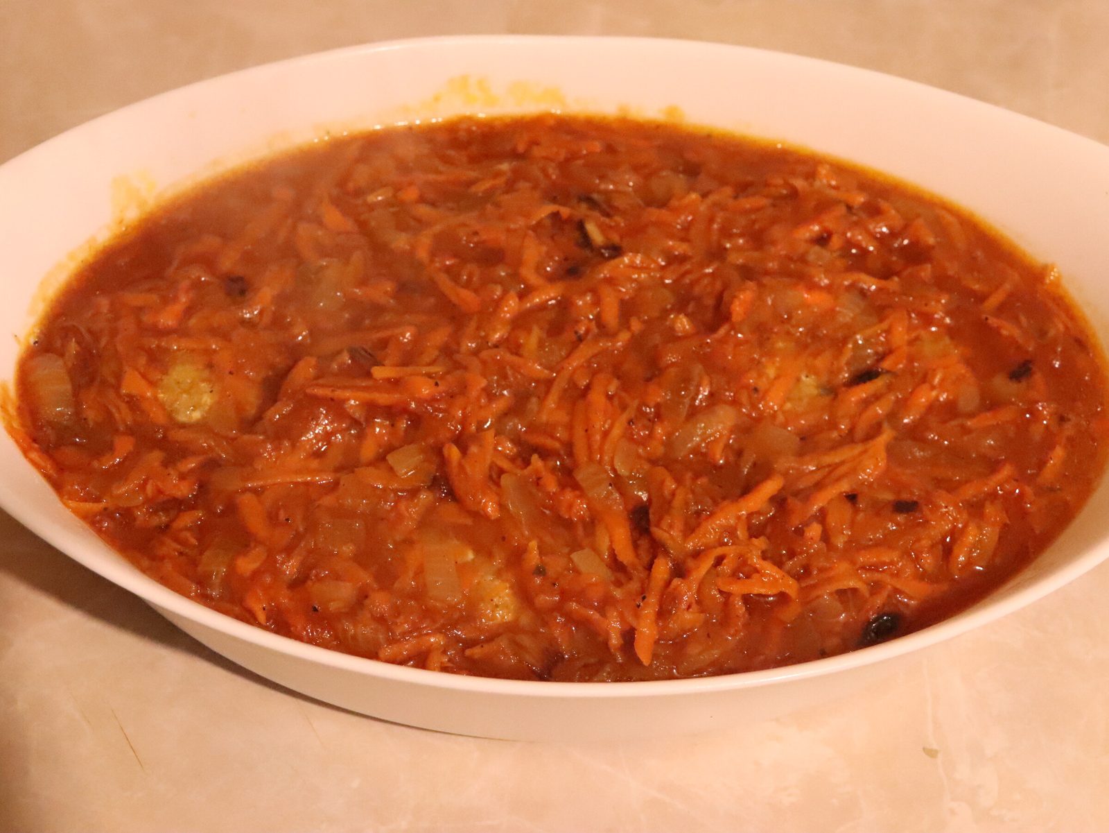 Step 4. We pass the fillet through a meat grinder through a fine mesh; we also pass the. Fish meatballs in tomato sauce