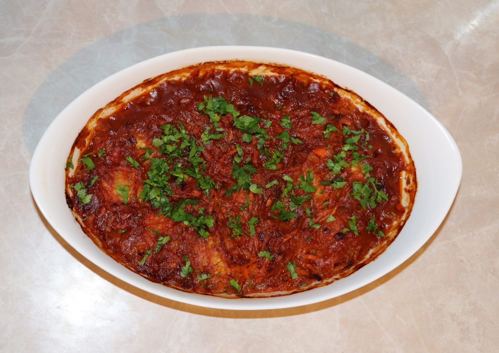Step 5. Add boiled rice, salt, and ground black pepper to the minced meat to taste. Fish meatballs in tomato sauce