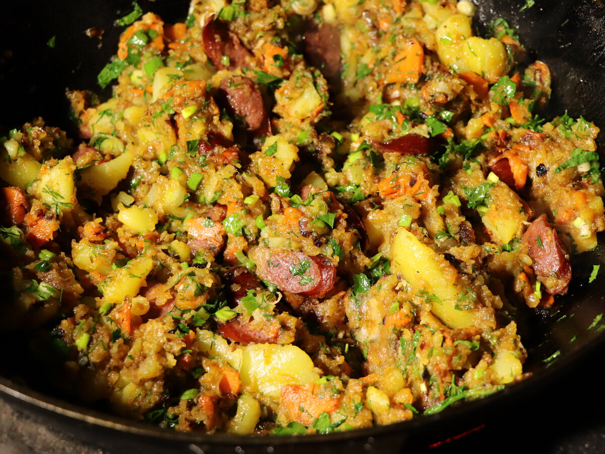 Fried potatoes in a kazan over the fire