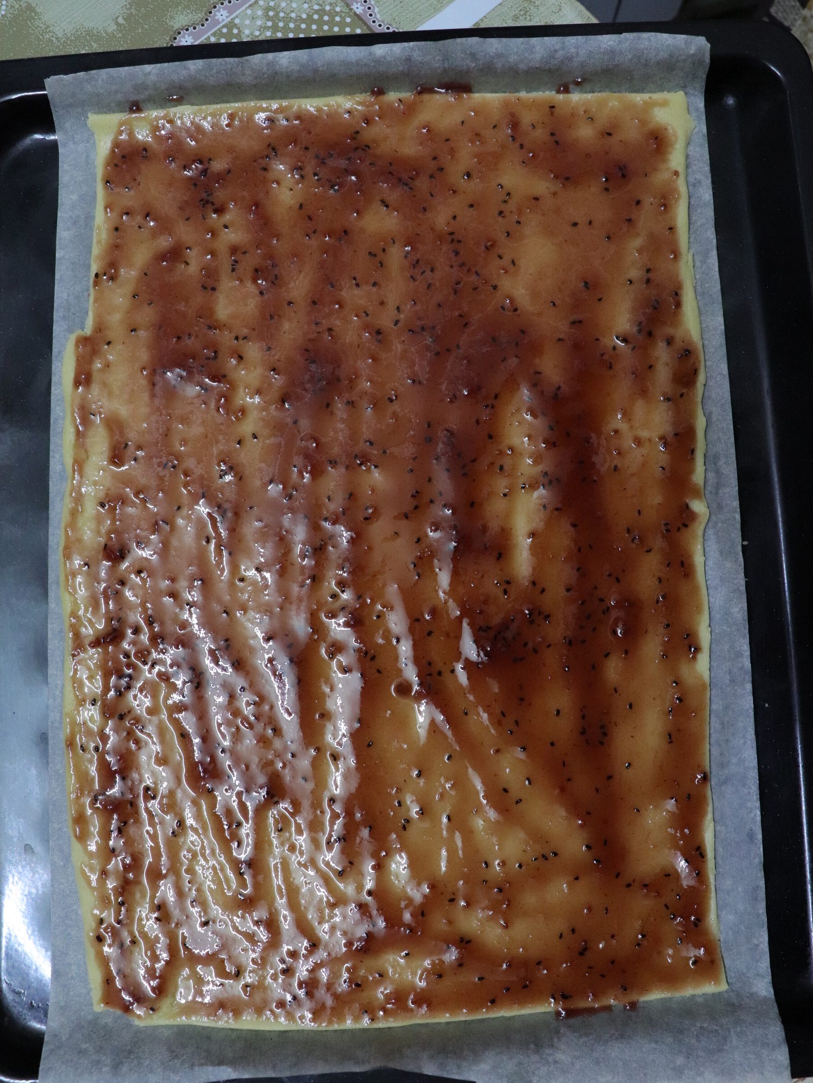 Step 7. Spread jam on the dough. Grated shortcrust jam tart