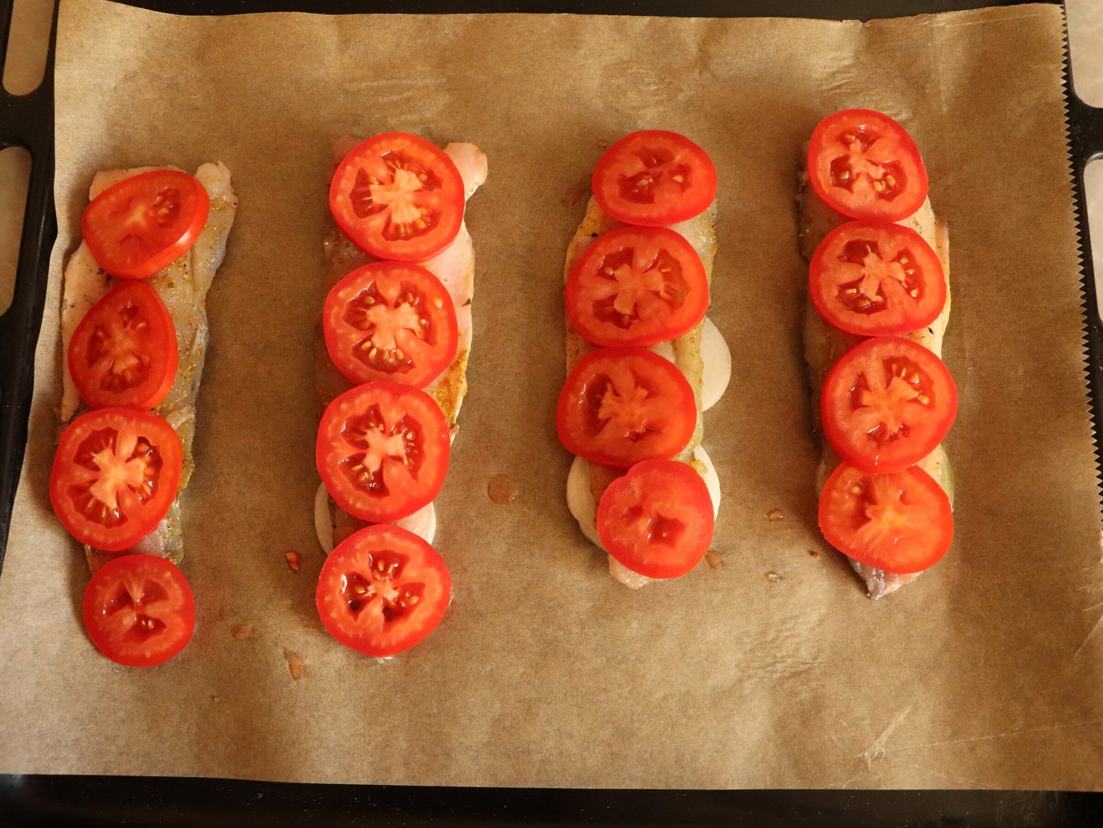 Step 4. Cover the baking tray with baking parchment. Grey mullet fillets baked with cheese