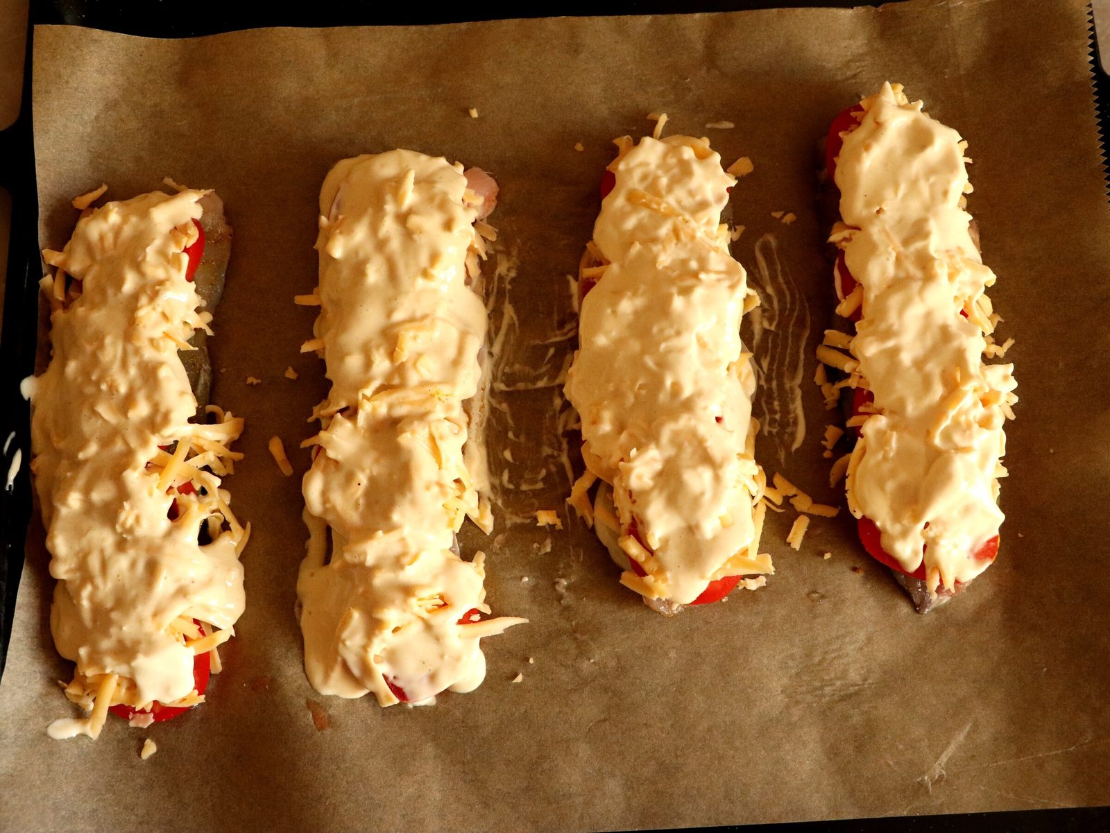 Step 5. Place the fillet on top of the onion, skin side down. Grey mullet fillets baked with cheese
