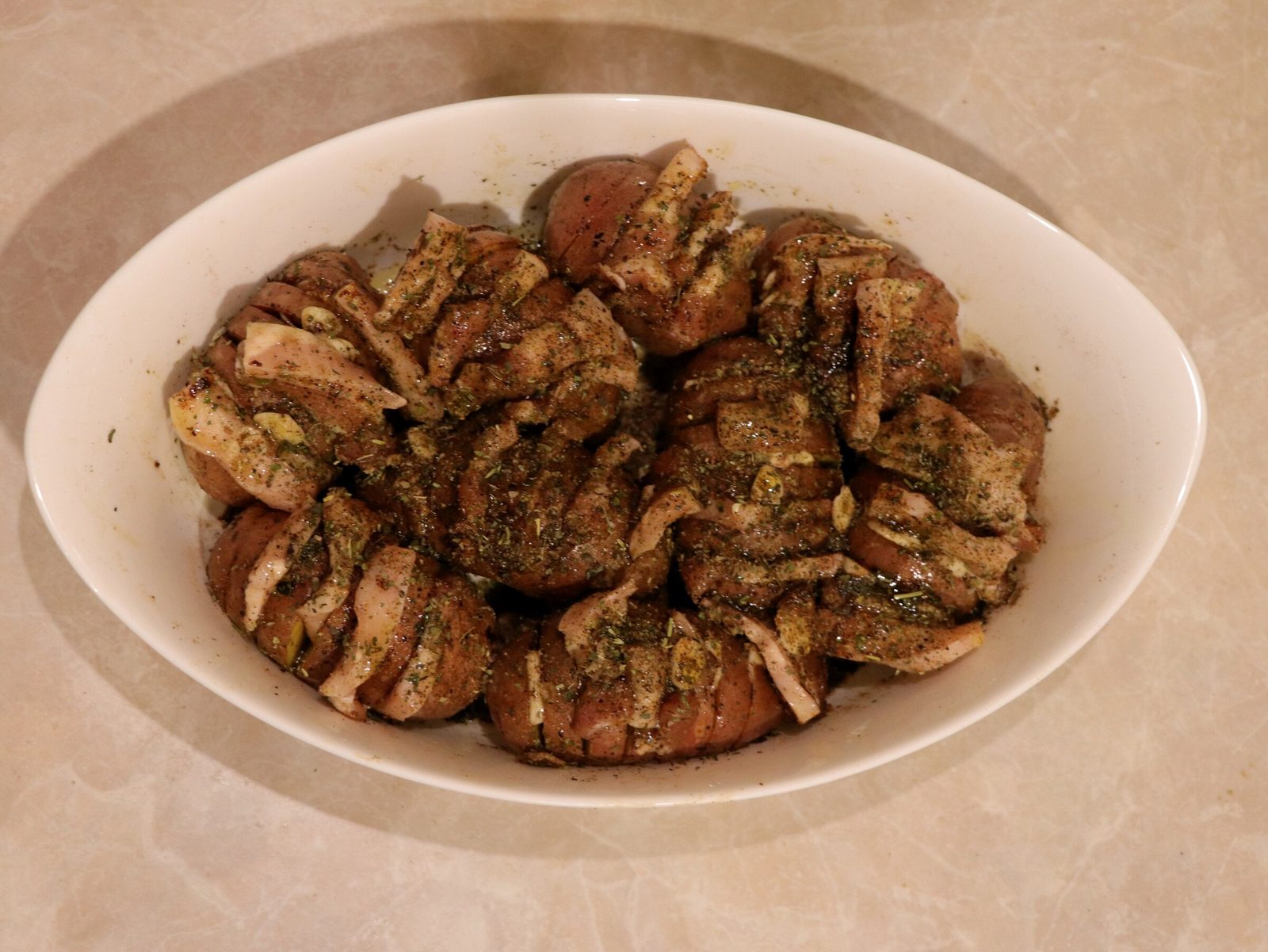 Step 3. Place in a preheated oven at 200°C for 40-50 minutes. Hasselback roast potatoes