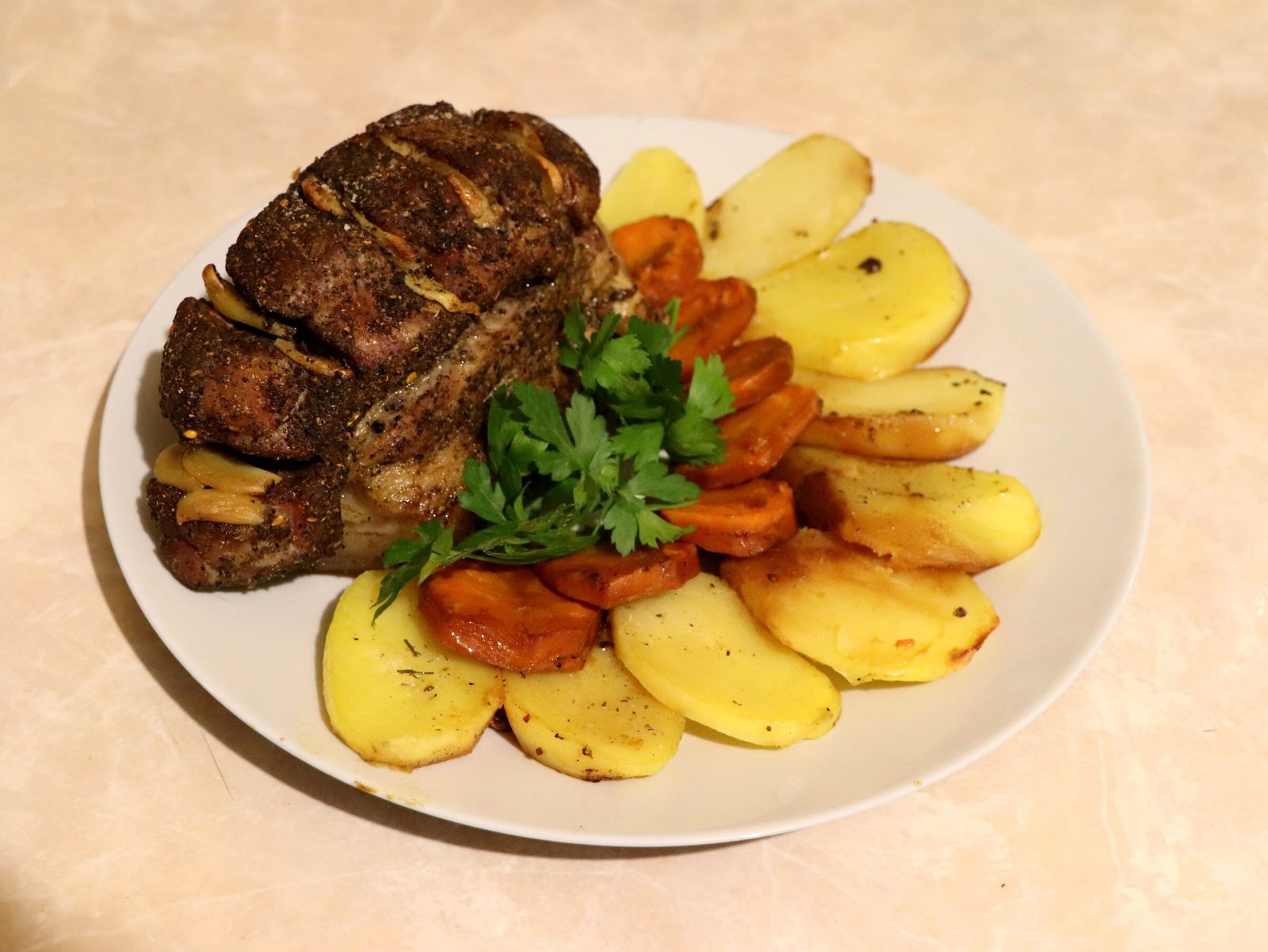 Juicy brisket on a bed of vegetables