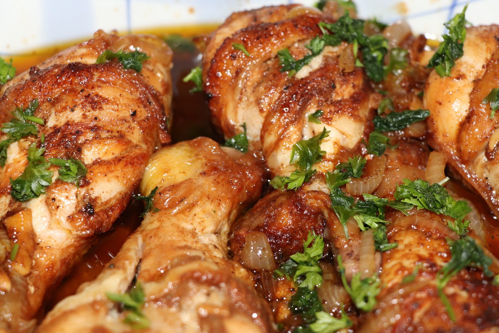 Juicy chicken drumsticks in the pan