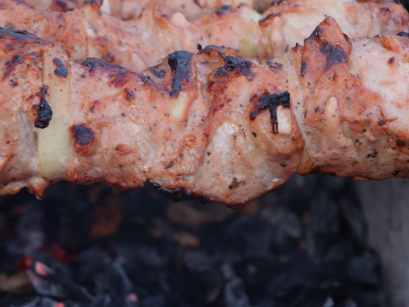 Step 8. Mushrooms or mackerel on the same fire are good extras. Juicy pork shashlik