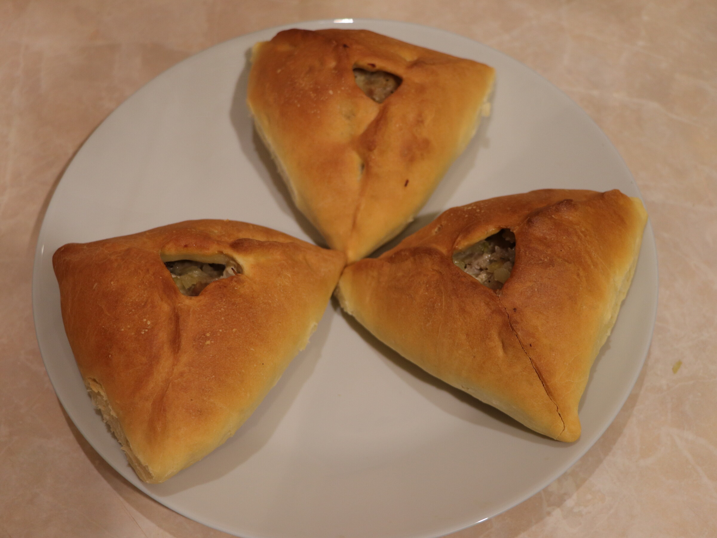 Step 6. Bake in a preheated oven at 180°C for about 45-50 minutes. Lazy meat triangles