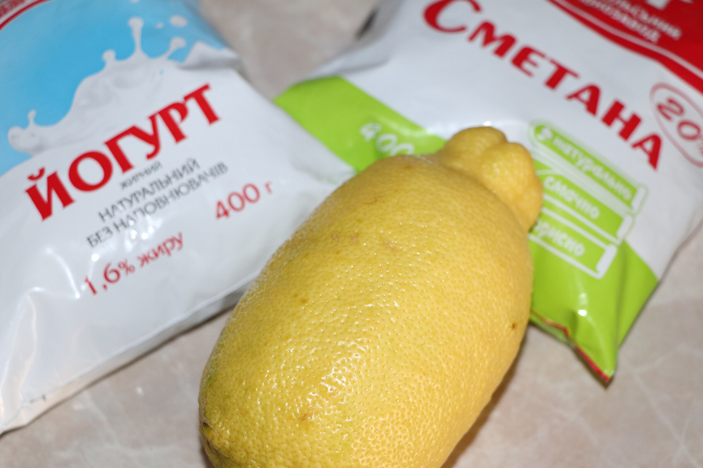 Step 2. In a deep bowl, mix soured cream, yogurt and add 1 tablespoon of lemon juice. Mascarpone