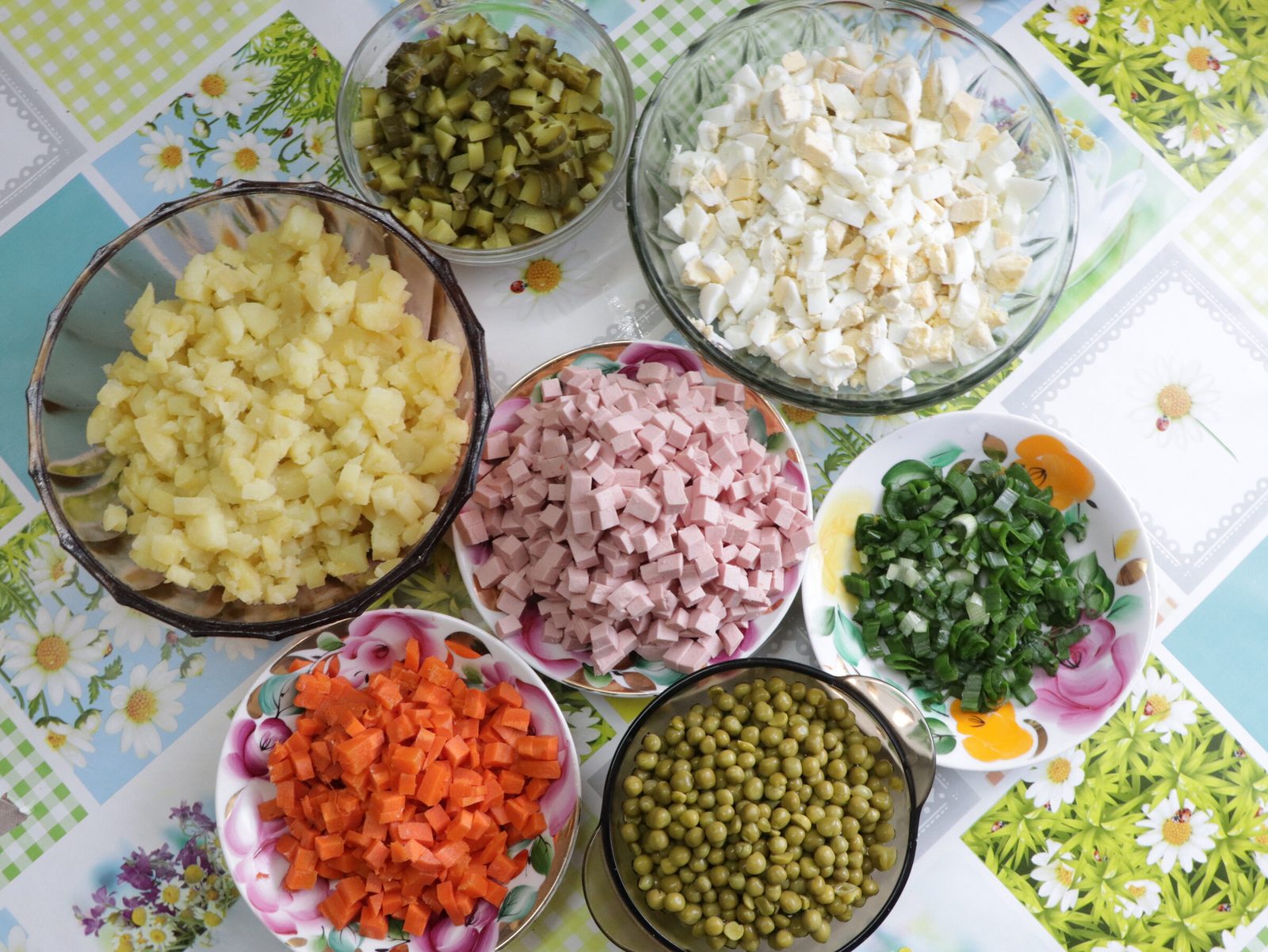 Step 3. I cut the potato first and tease apart any stuck cubes by hand, then add eggs,. Olivier salad