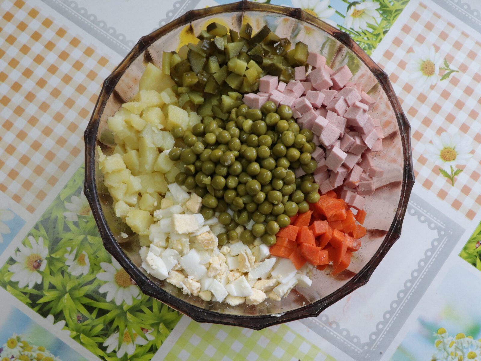 Step 5. Potato, eggs, carrot and sausage in a lidded box; cucumbers apart; peas and. Olivier salad