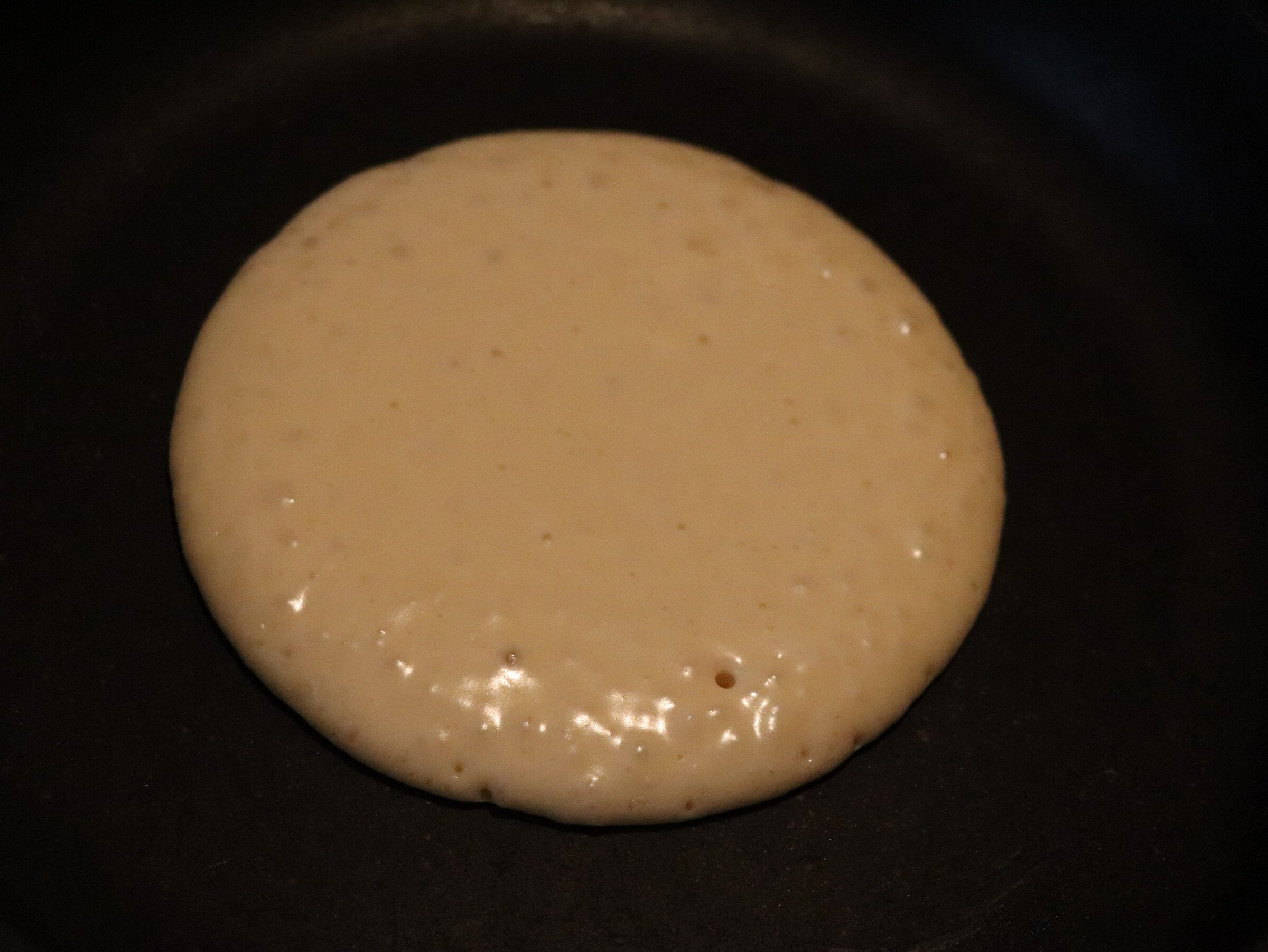 Step 5. When the first bubbles appear on top, turn the pancake over. Pancakes (American-style)