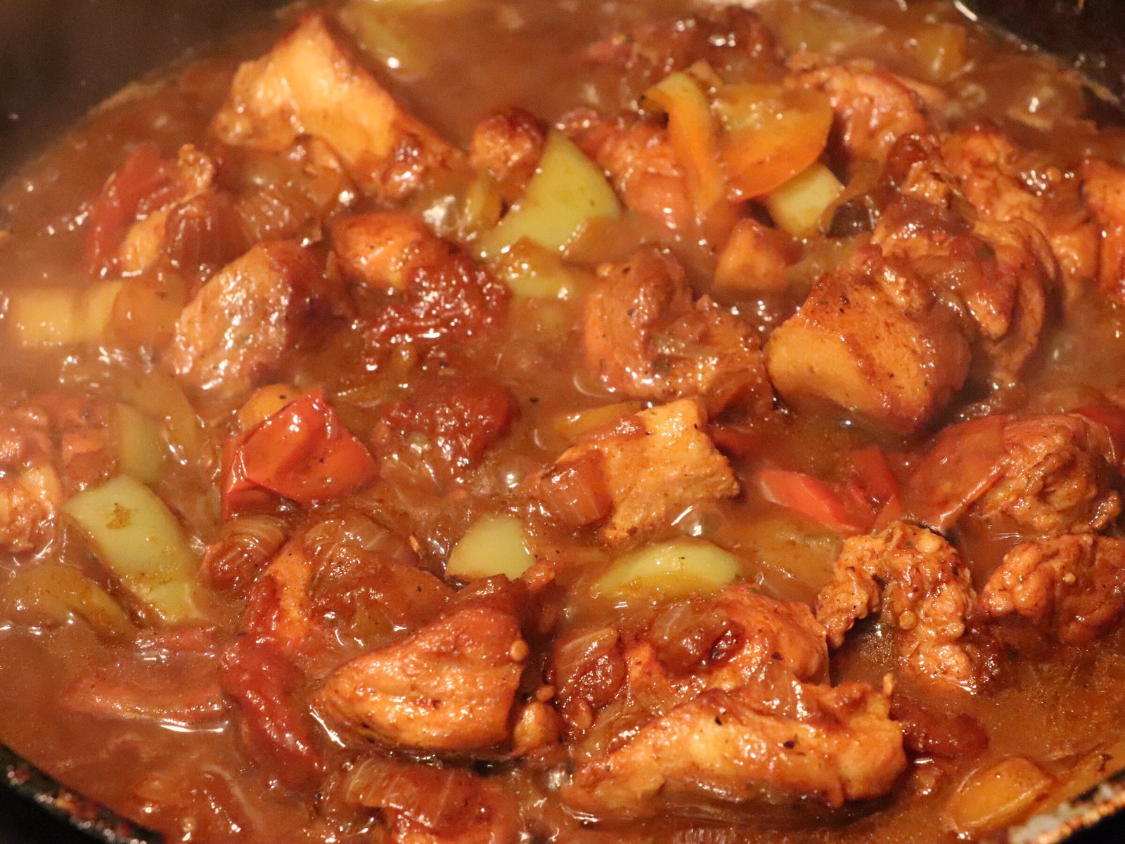 Step 4. Add spices and pour in water, bring to a boil and simmer over low heat for. Pork goulash with peppers and tomatoes