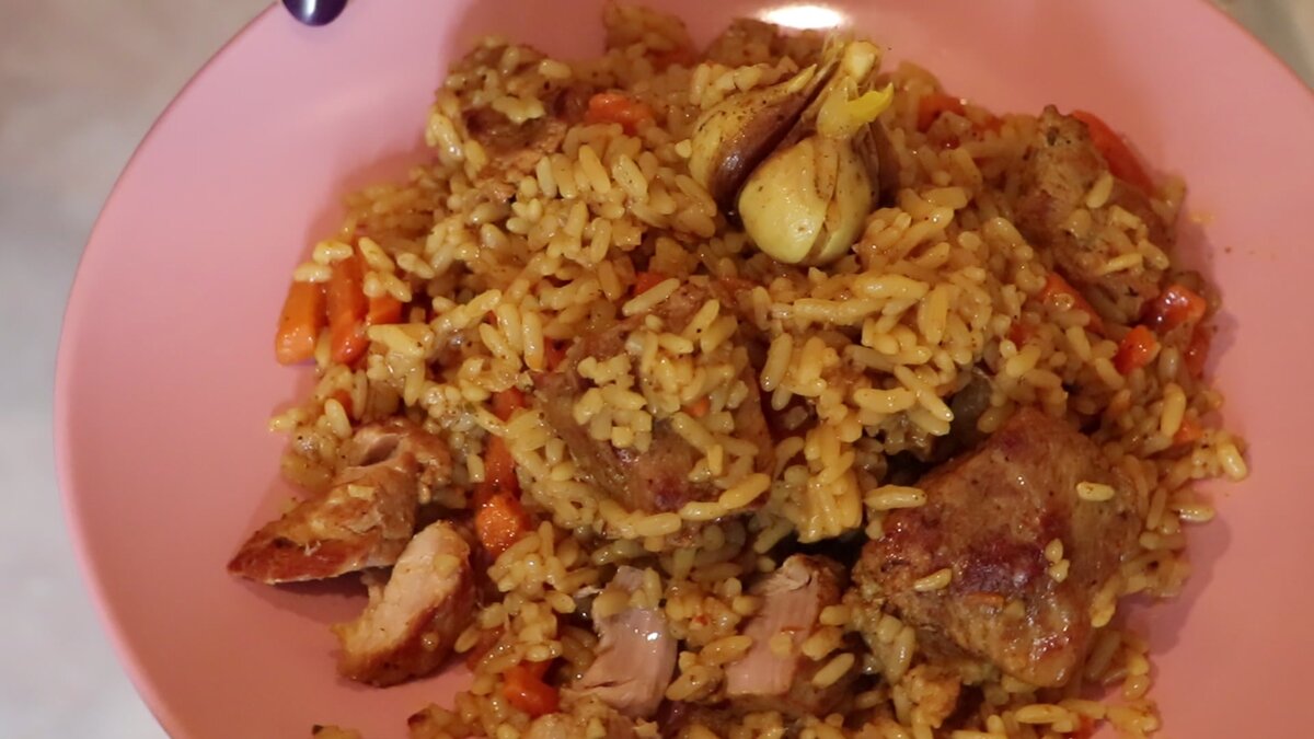 Pork plov with tender meat and fluffy rice