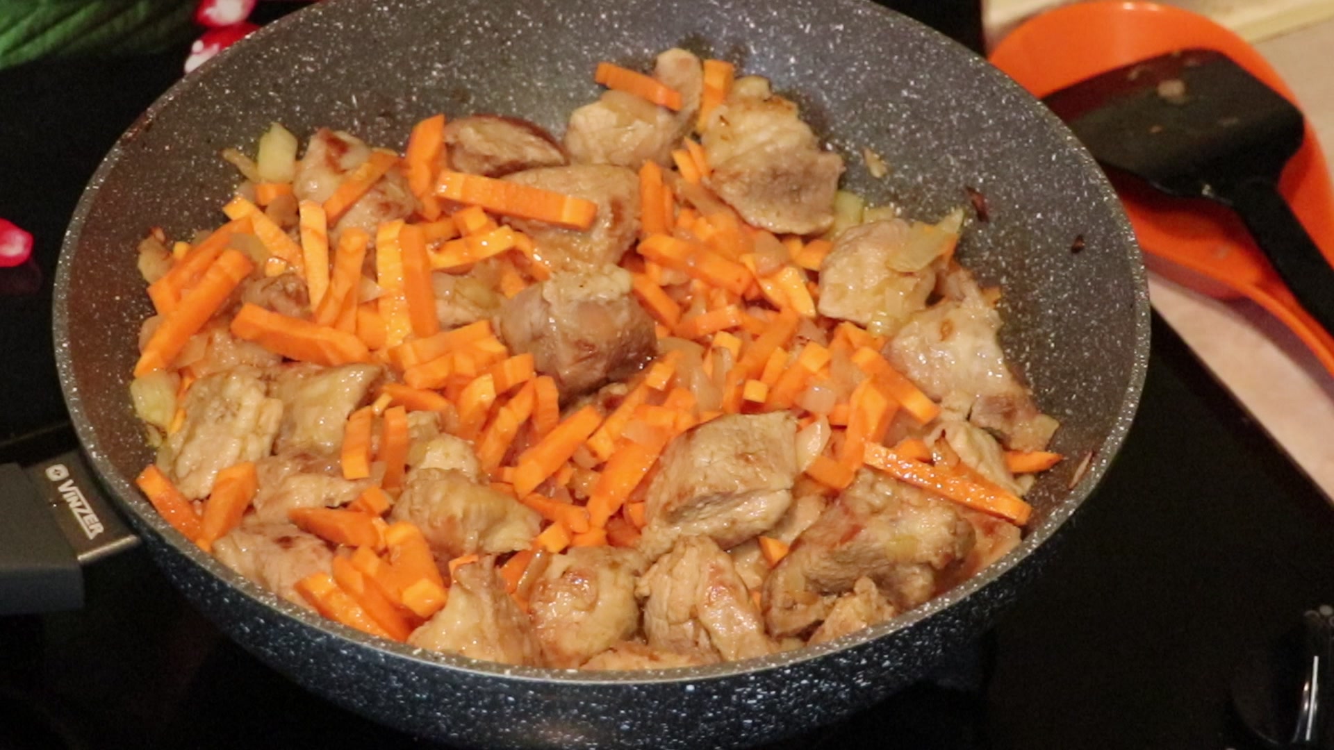 Step 2. When the onion is ready, add the carrots and fry until tender. Pork plov with tender meat and fluffy rice