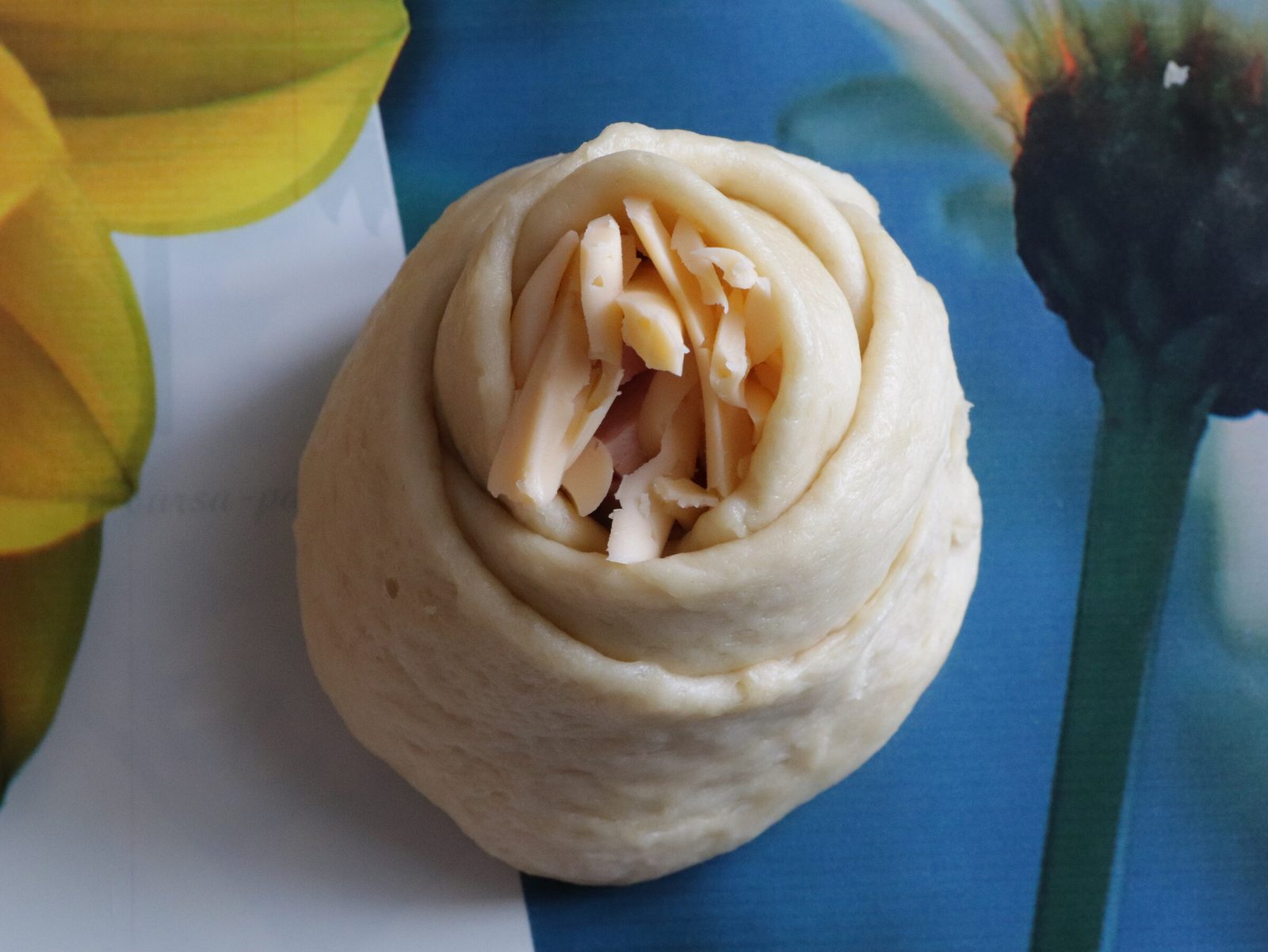 Step 6. We put some sausage in the middle, sprinkle cheese on top and begin to form our. Quick sausage roses