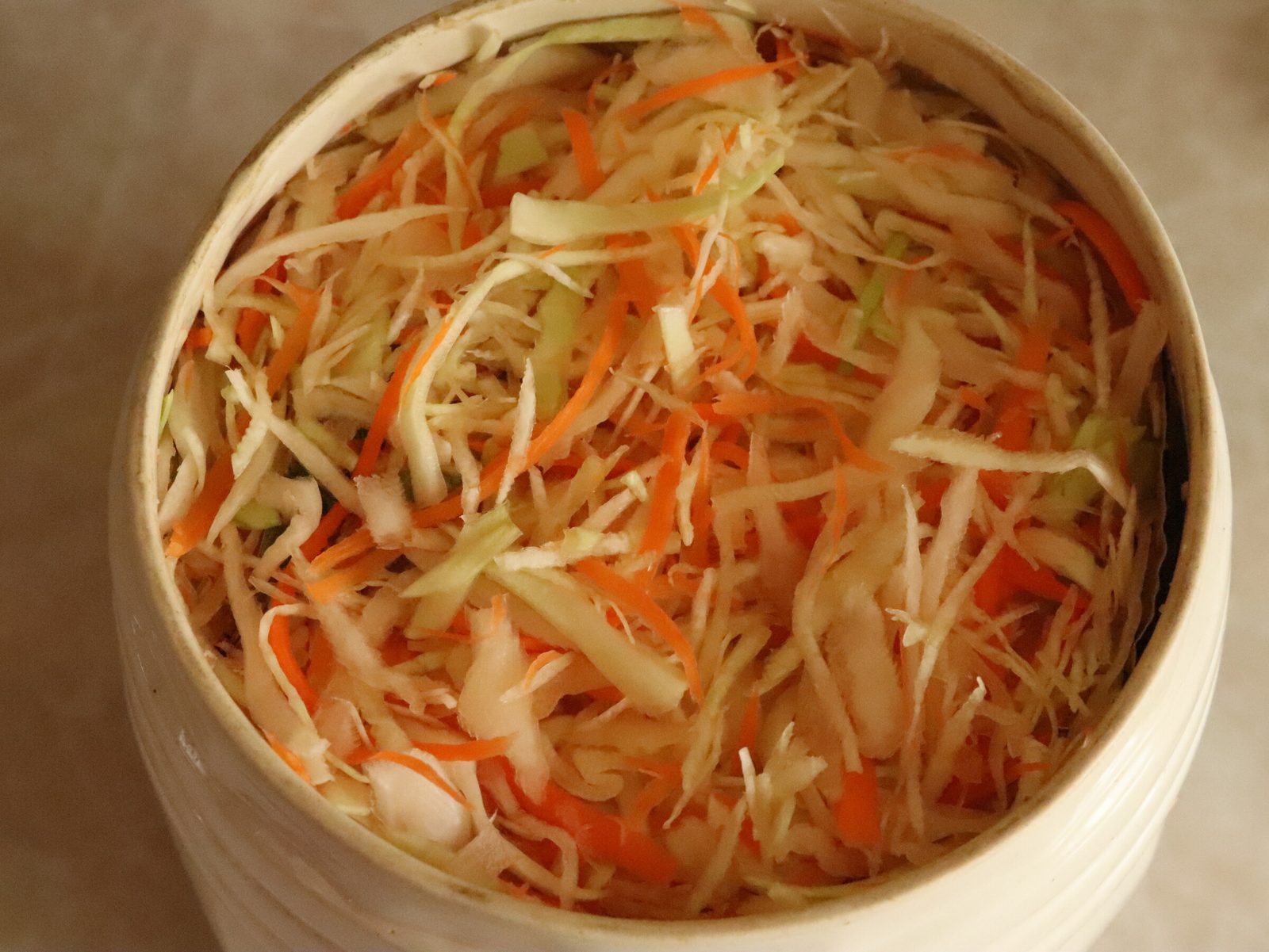 Step 8. Pack tightly into the jar, tamping with a rolling pin so almost no air remains. Sauerkraut