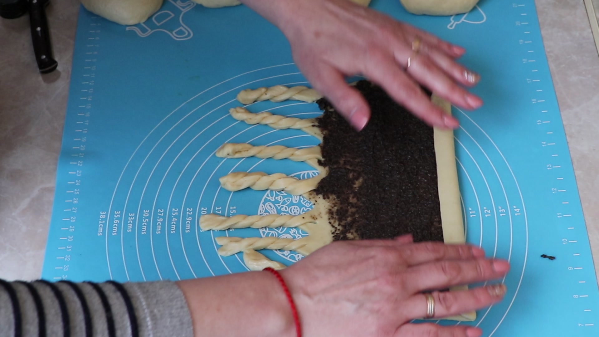 Step 7. Take 2 strips and twist them into a pigtail. Soft poppy-seed rolls