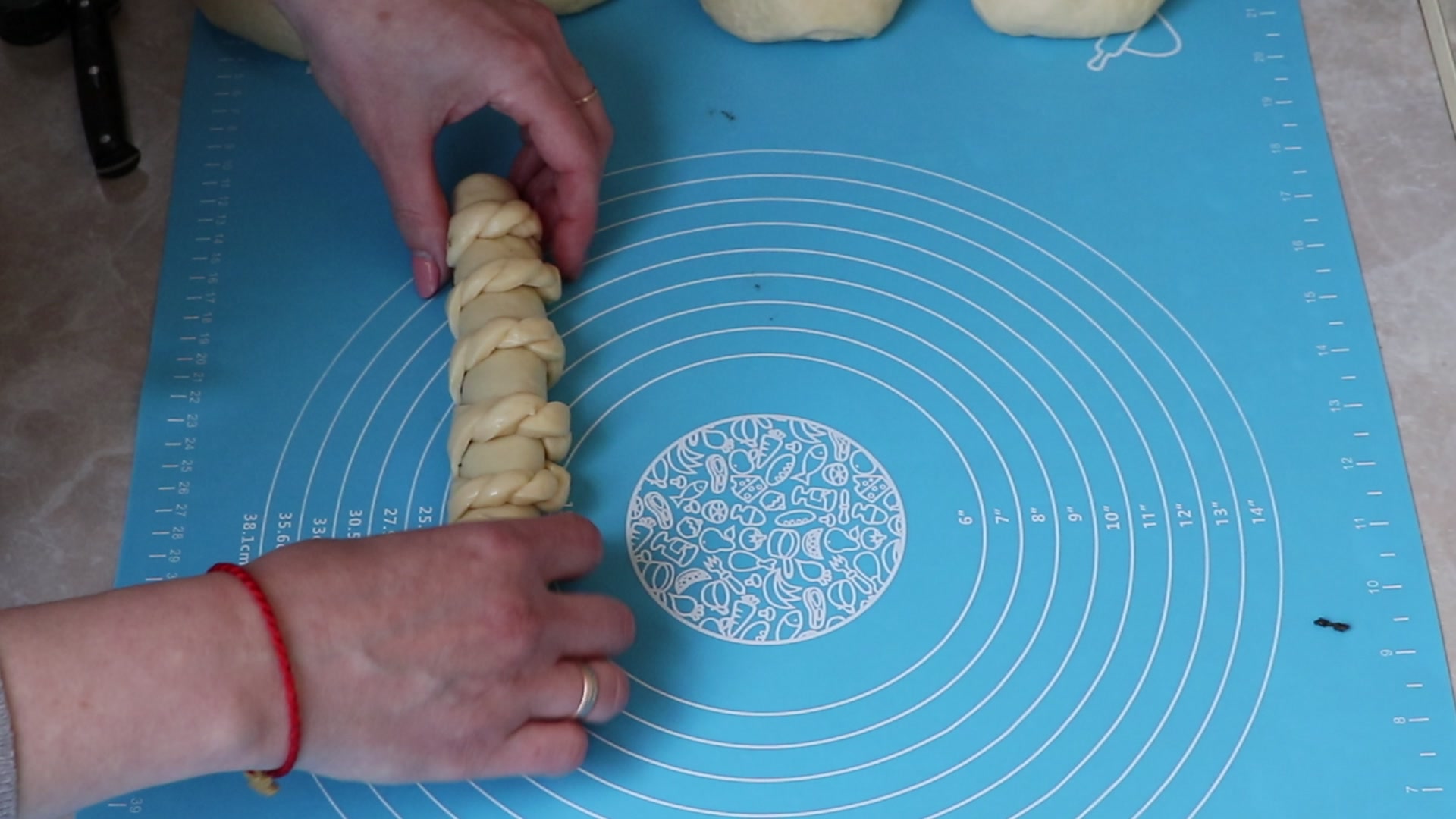 Step 8. We wrap the roll with the filling in the middle, the braids will be on top. Soft poppy-seed rolls