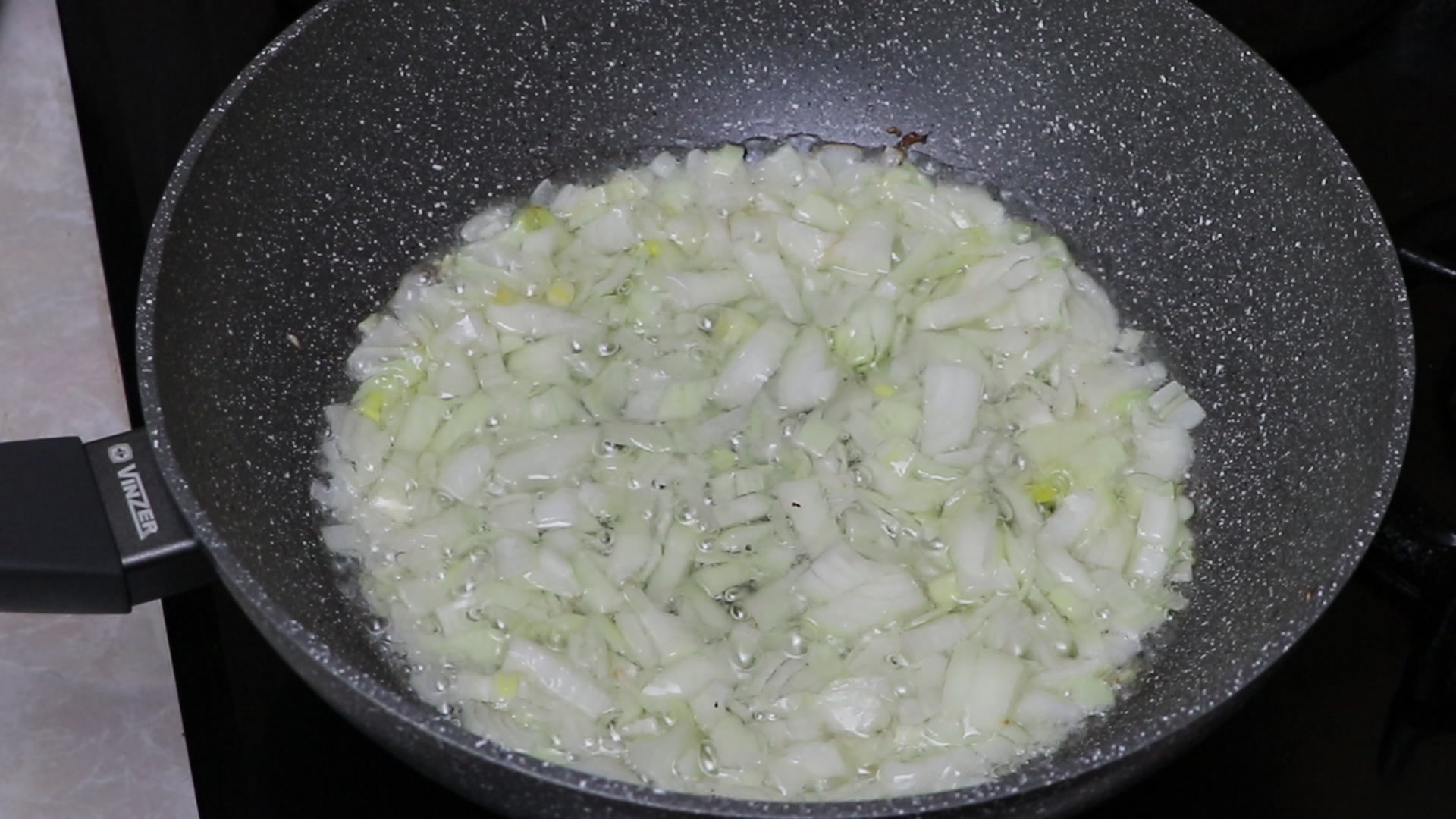 Step 2. Pour vegetable oil into a deep frying pan, heat it and add finely chopped onion. Spiced okra stew
