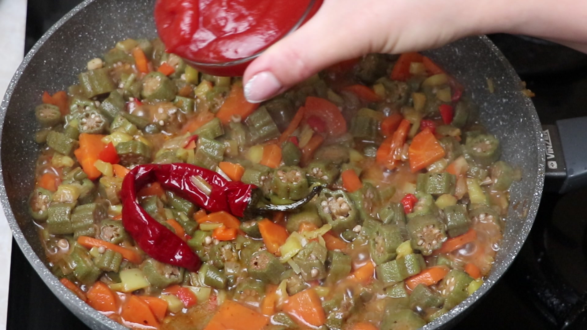 Step 6. When almost all the liquid has evaporated, add spices and tomato sauce. Spiced okra stew