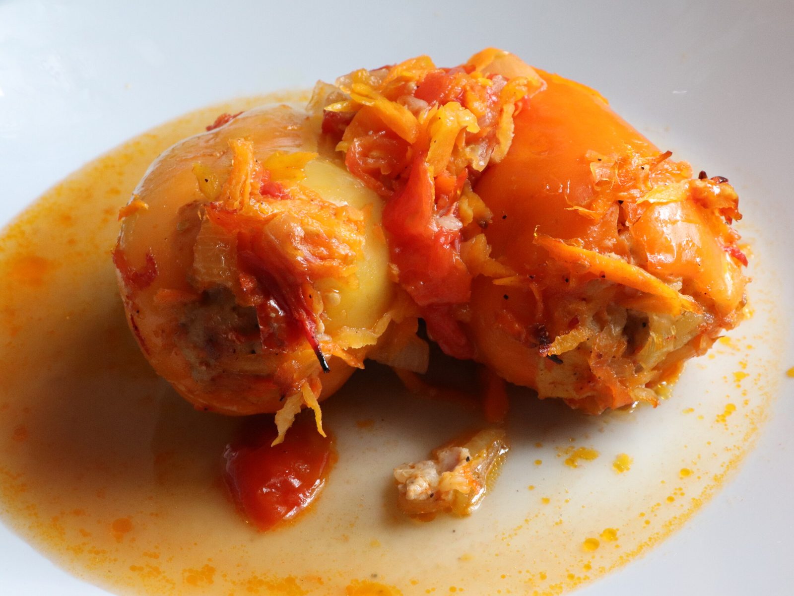 Step 5. Fill the peppers with the prepared filling and place them in a deep baking. Stuffed peppers in a tomato dressing