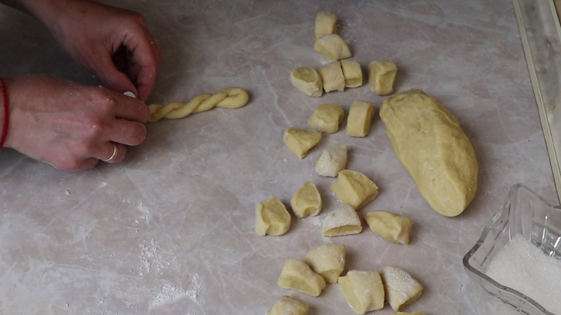 Step 7. Fold in half and plait the two strands over each other. Sugar-braid kefir biscuits from childhood