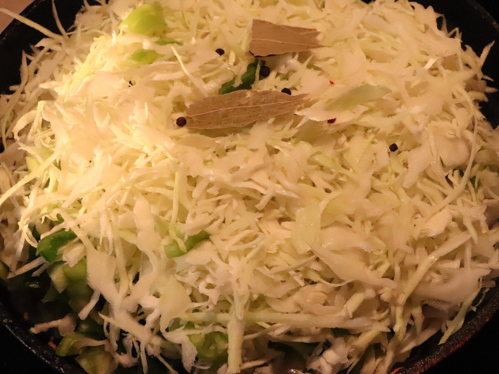 Step 4. Add cabbage and diced peppers, lower the heat and cover. The best braised cabbage