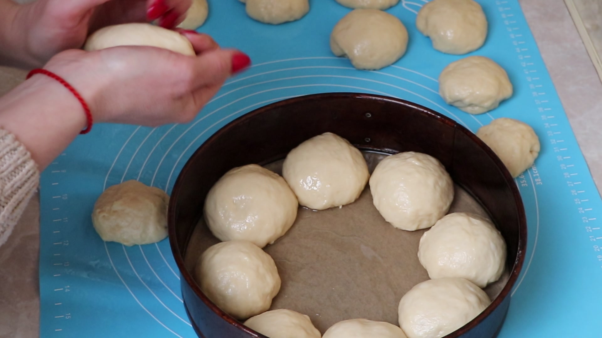 Step 3. For the dough, add sugar, vanilla sugar and yeast to warm milk. The fluffiest buns with a sugar sprinkle