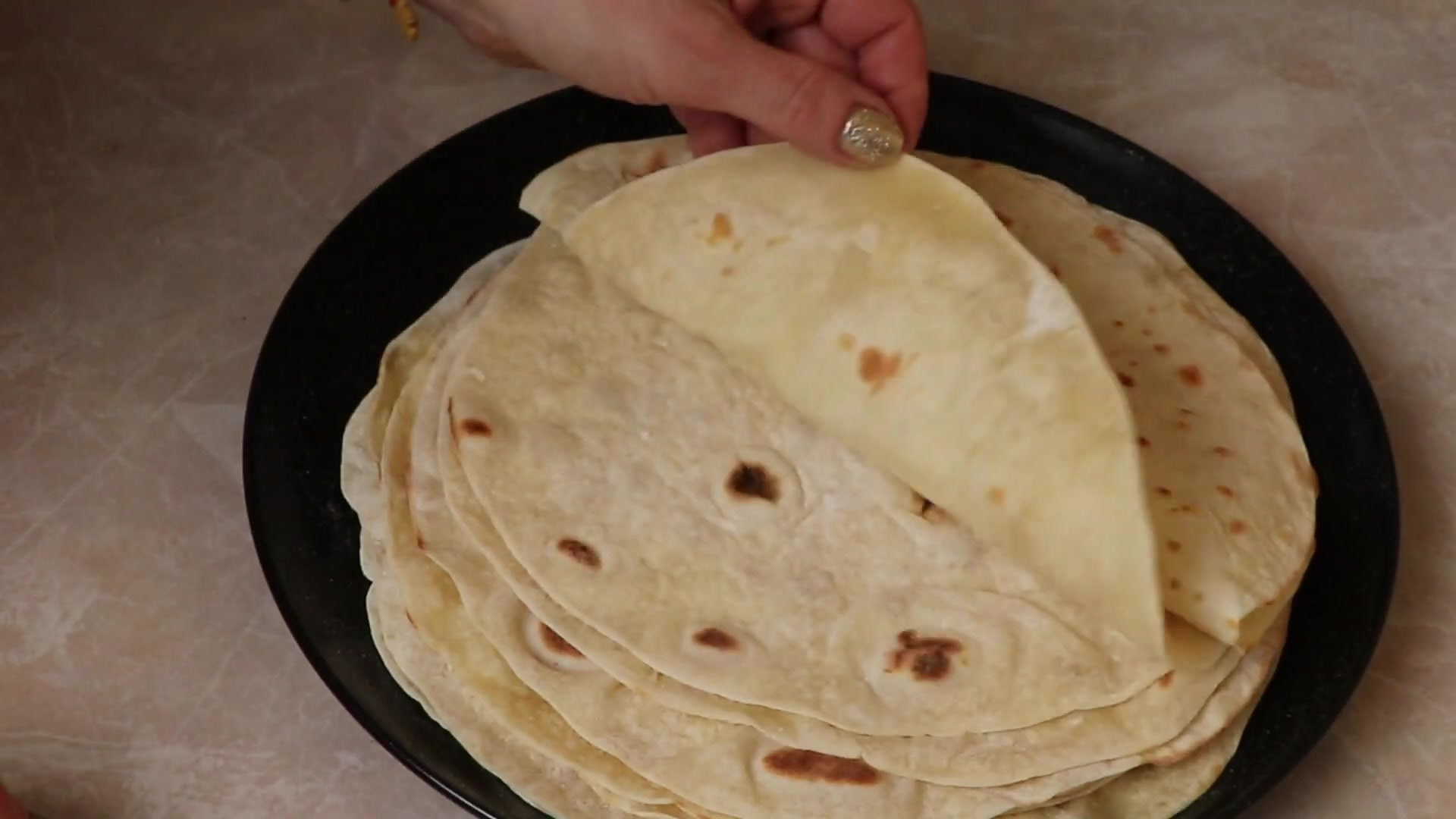 The thinnest pita bread in a frying pan for pennies!