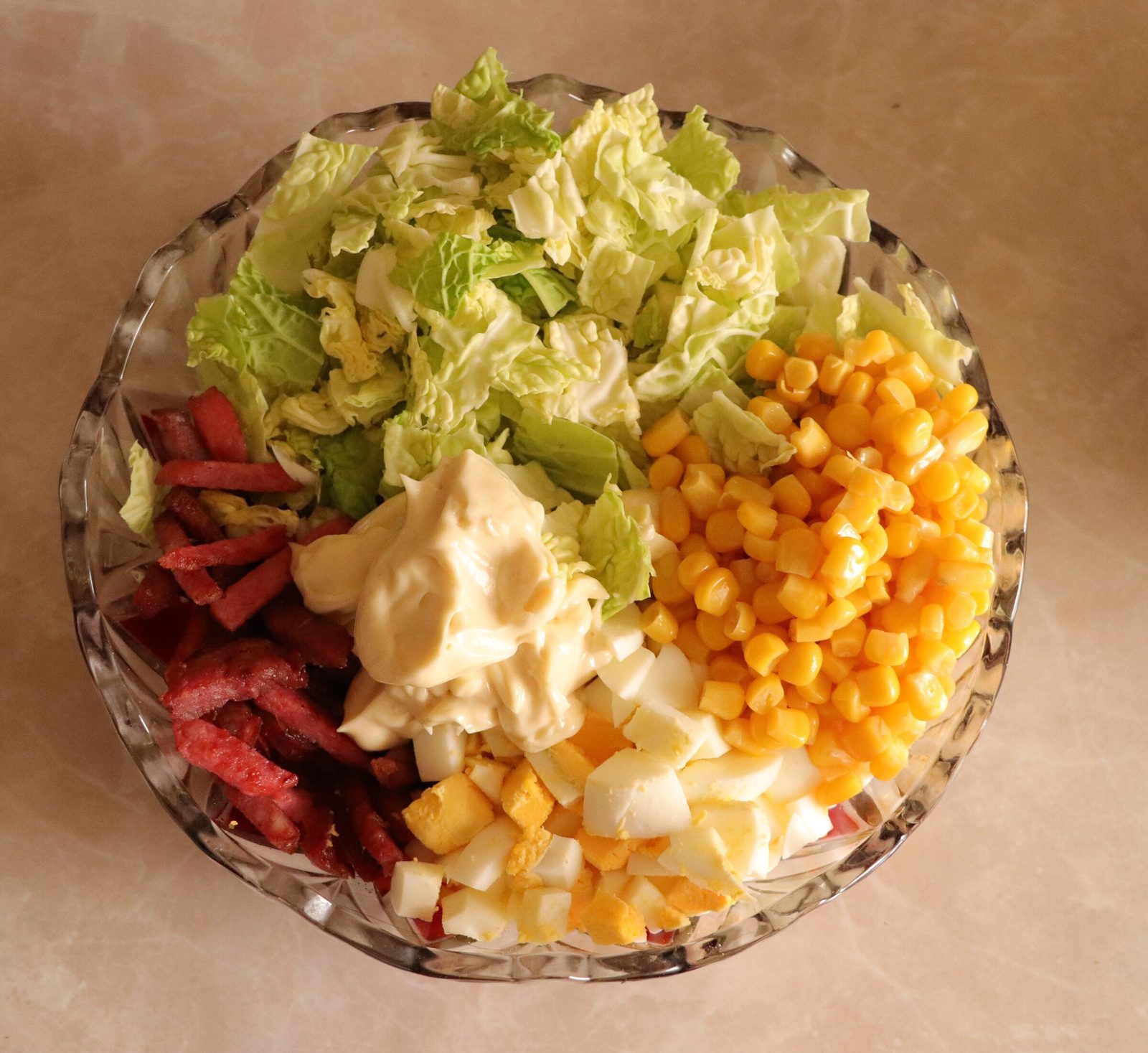 Step 1. Canned corn – 150 g Crab sticks – 150 g Mayonnaise – 100 g Salt – to taste. Two cabbage salads — change one thing