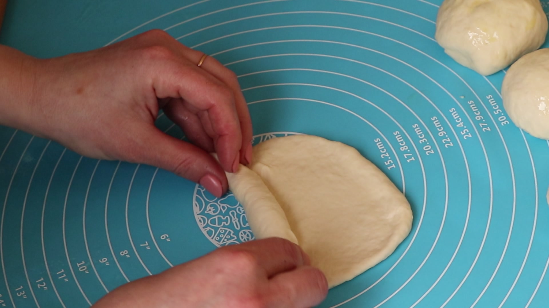 Step 5. Roll the ball into an oval shape with a rolling pin and tightly roll it into a. Viennese rolls — instead of bread