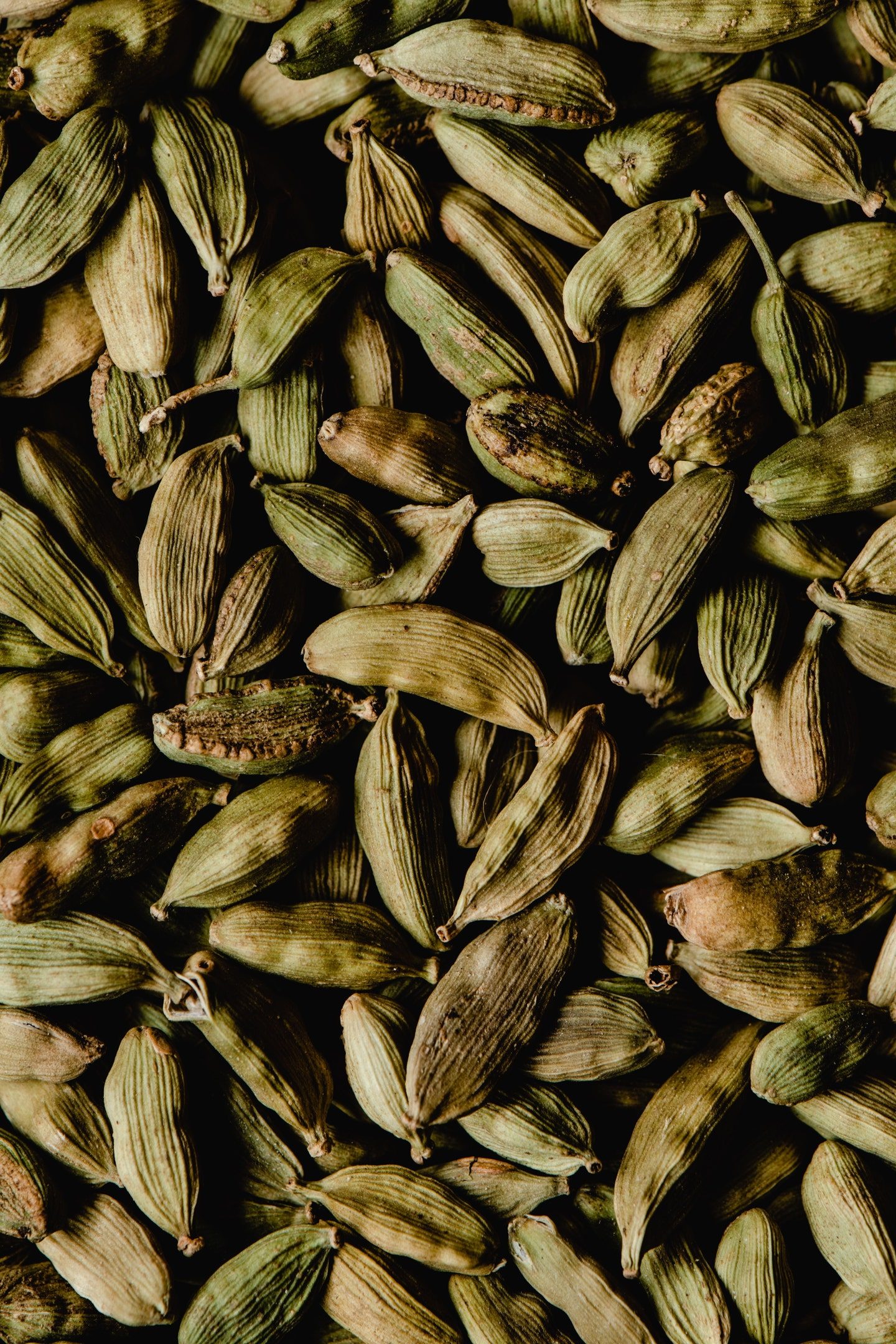 A quiet jar of cardamom pods