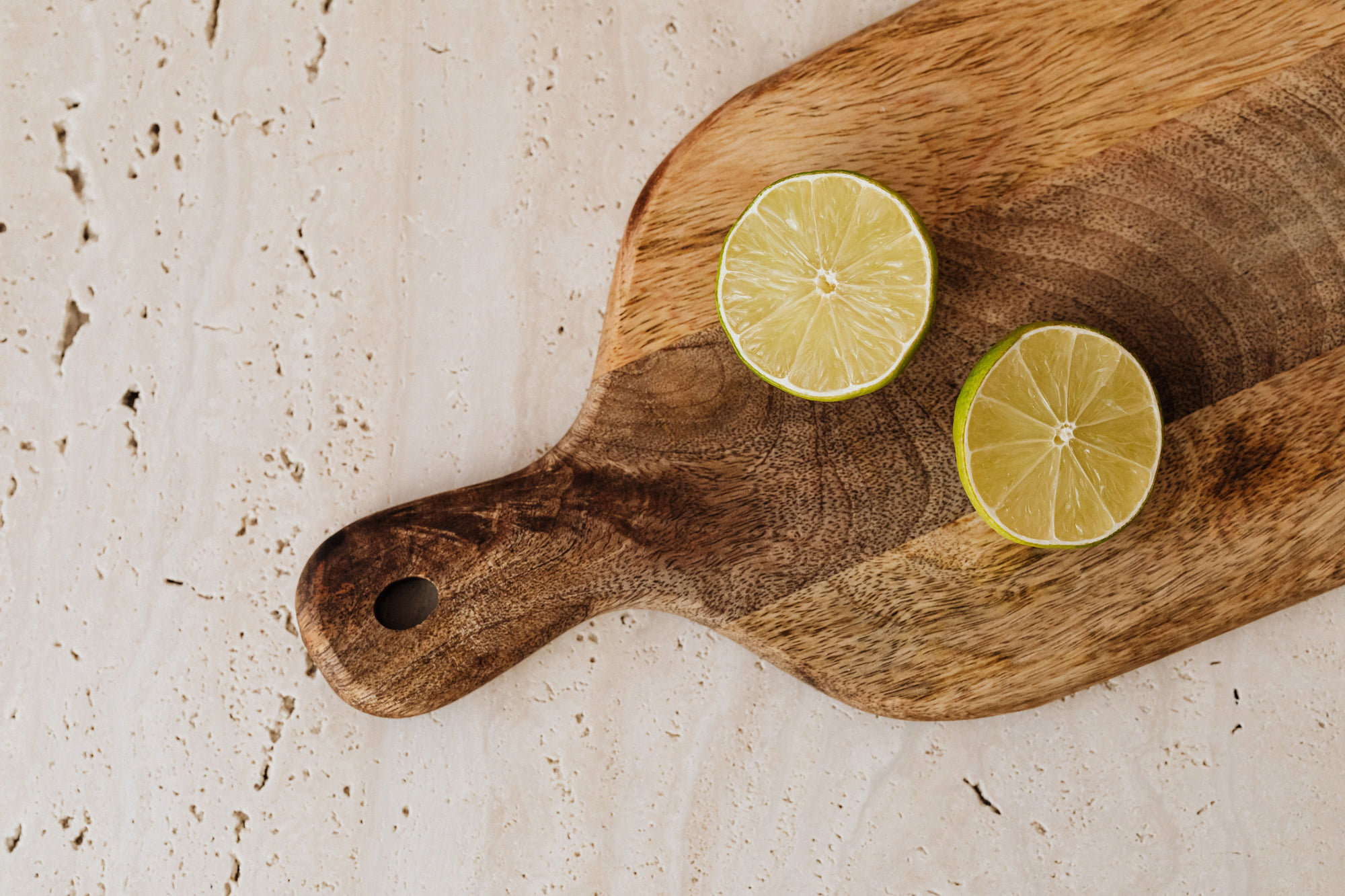 A cut lime — cut-side down or jar, not drying on the board