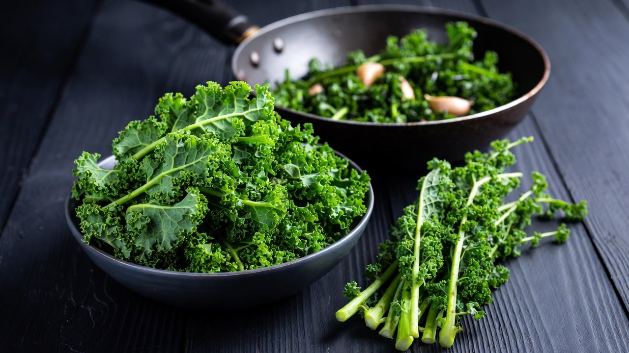 I strip kale off the stalk by hand — and keep the stalks